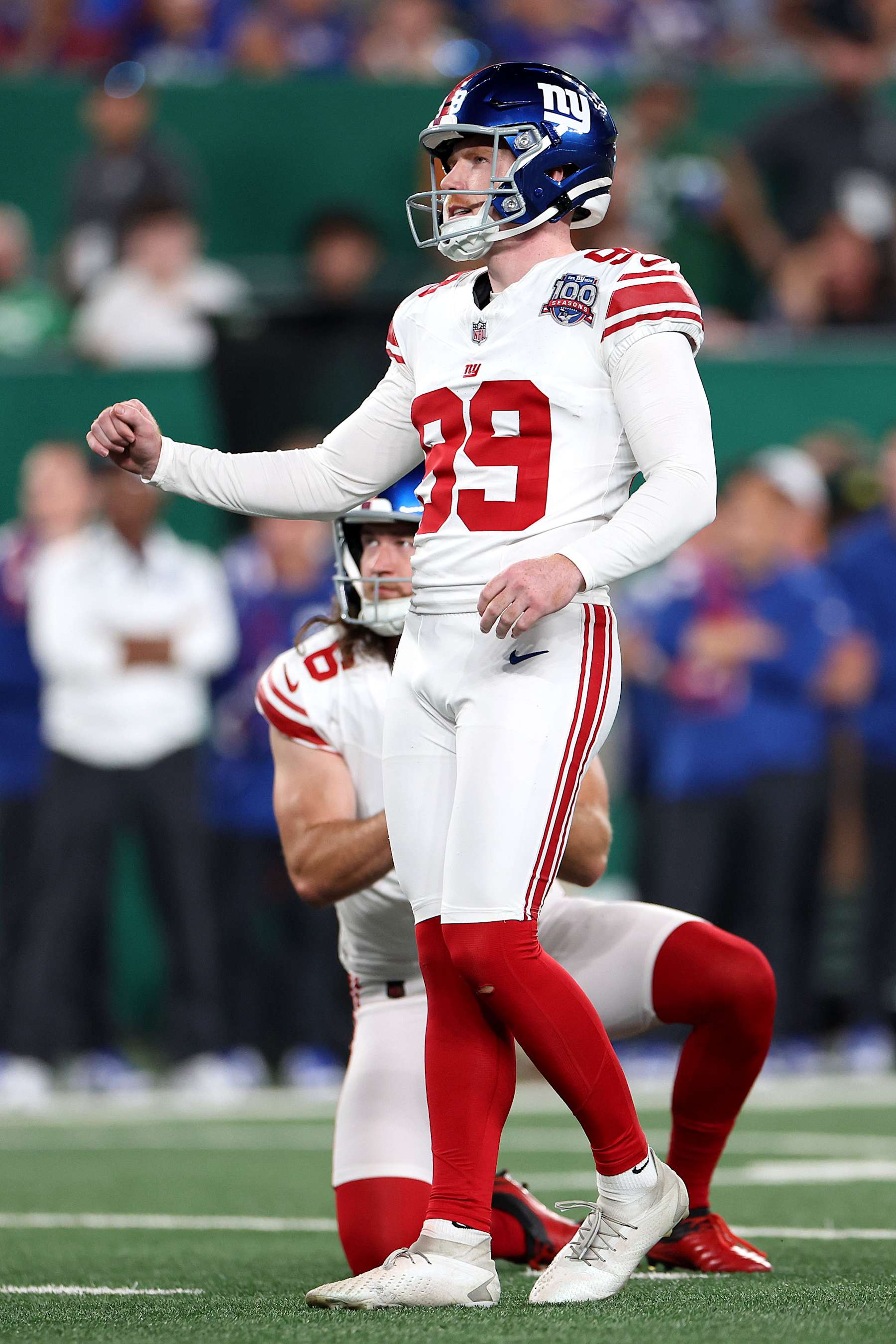EAST RUTHERFORD, NEW JERSEY - AUGUST 24: Jude McAtamney #99 of the New York Giants kicks against the New York Jets during a preseason game at MetLife Stadium on August 24, 2024 in East Rutherford, New Jersey.  (Photo by Luke Hales/Getty Images)