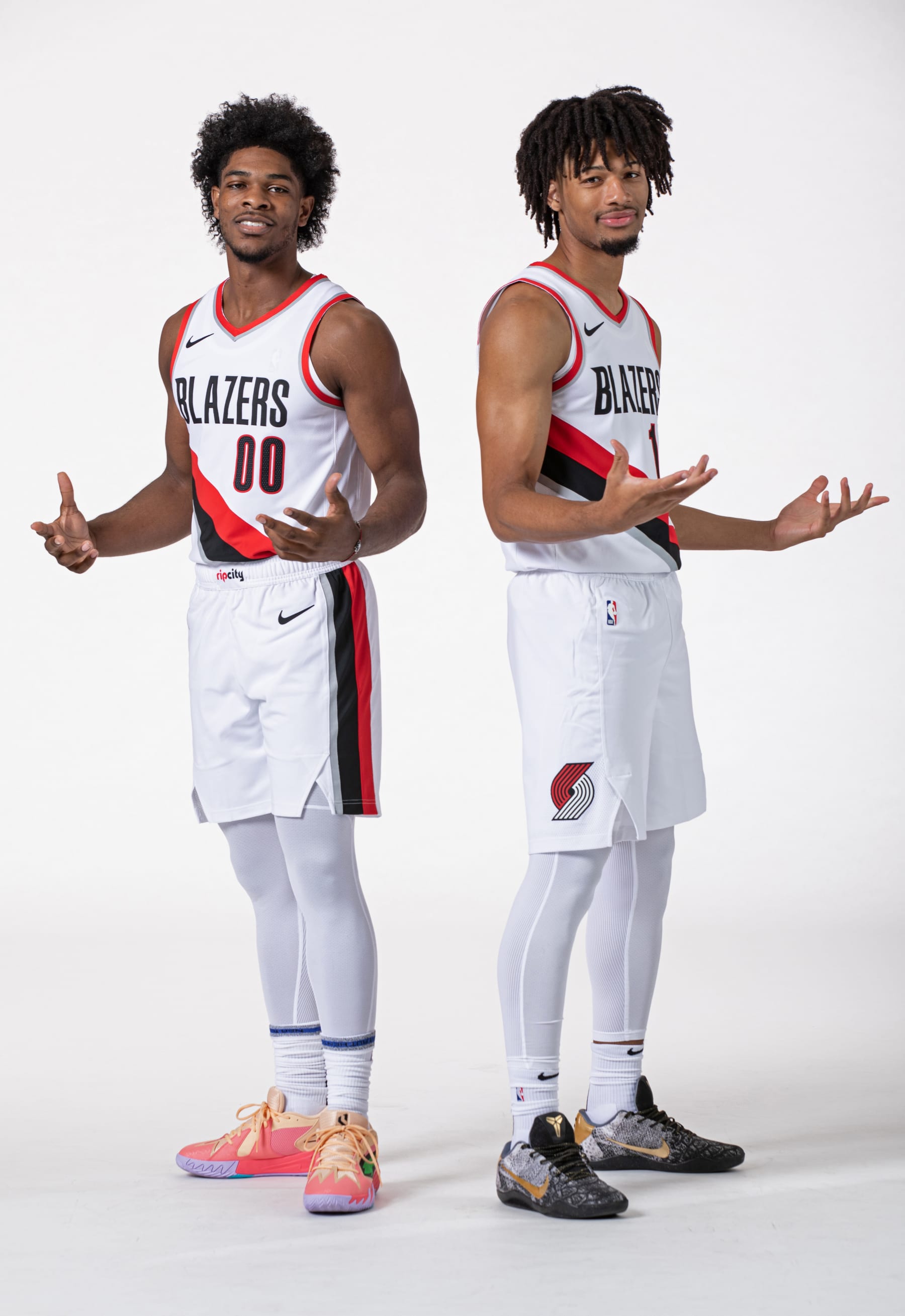 PORTLAND, OR - OCTOBER 2: Scoot Henderson #00 and Shaedon Sharpe #17 of the Portland Trail Blazers poses for a portrait during 2023-24 NBA Media Day on October 2, 2023 at the Moda Center Arena in Portland, Oregon. NOTE TO USER: User expressly acknowledges and agrees that, by downloading and or using this photograph, user is consenting to the terms and conditions of the Getty Images License Agreement. Mandatory Copyright Notice: Copyright 2023 NBAE (Photo by Cameron Browne/NBAE via Getty Images)