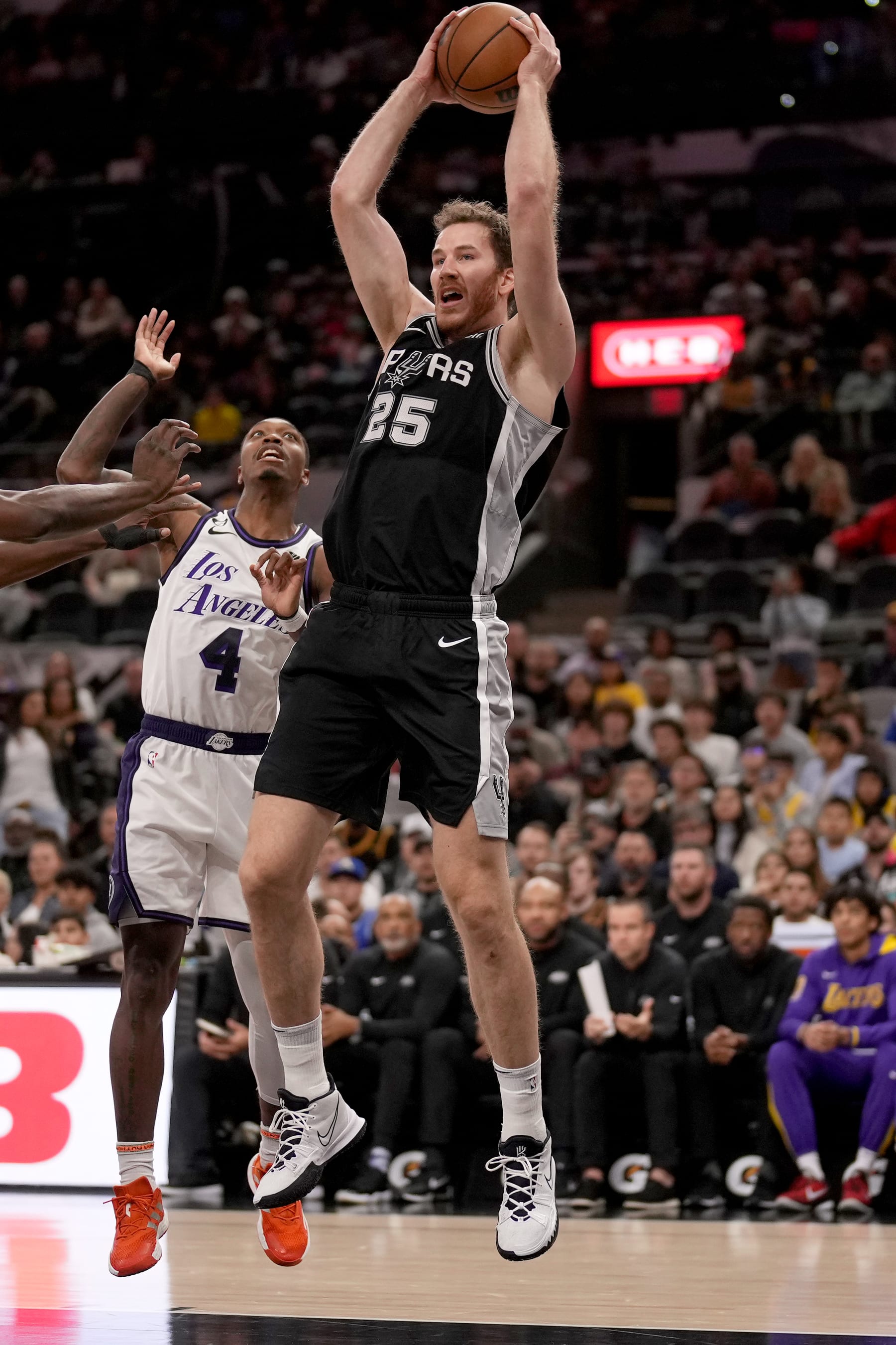 SAN ANTONIO, TX - NOVEMBER 26: Jakob Poeltl #25 of the San Antonio Spurs goes up for the rebound against the Los Angeles Lakers on November 26, 2022 at the AT&T Center in San Antonio, Texas. NOTE TO USER: User expressly acknowledges and agrees that, by downloading and or using this photograph, user is consenting to the terms and conditions of the Getty Images License Agreement. Mandatory Copyright Notice: Copyright 2022 NBAE (Photos by Darren Carroll/NBAE via Getty Images)