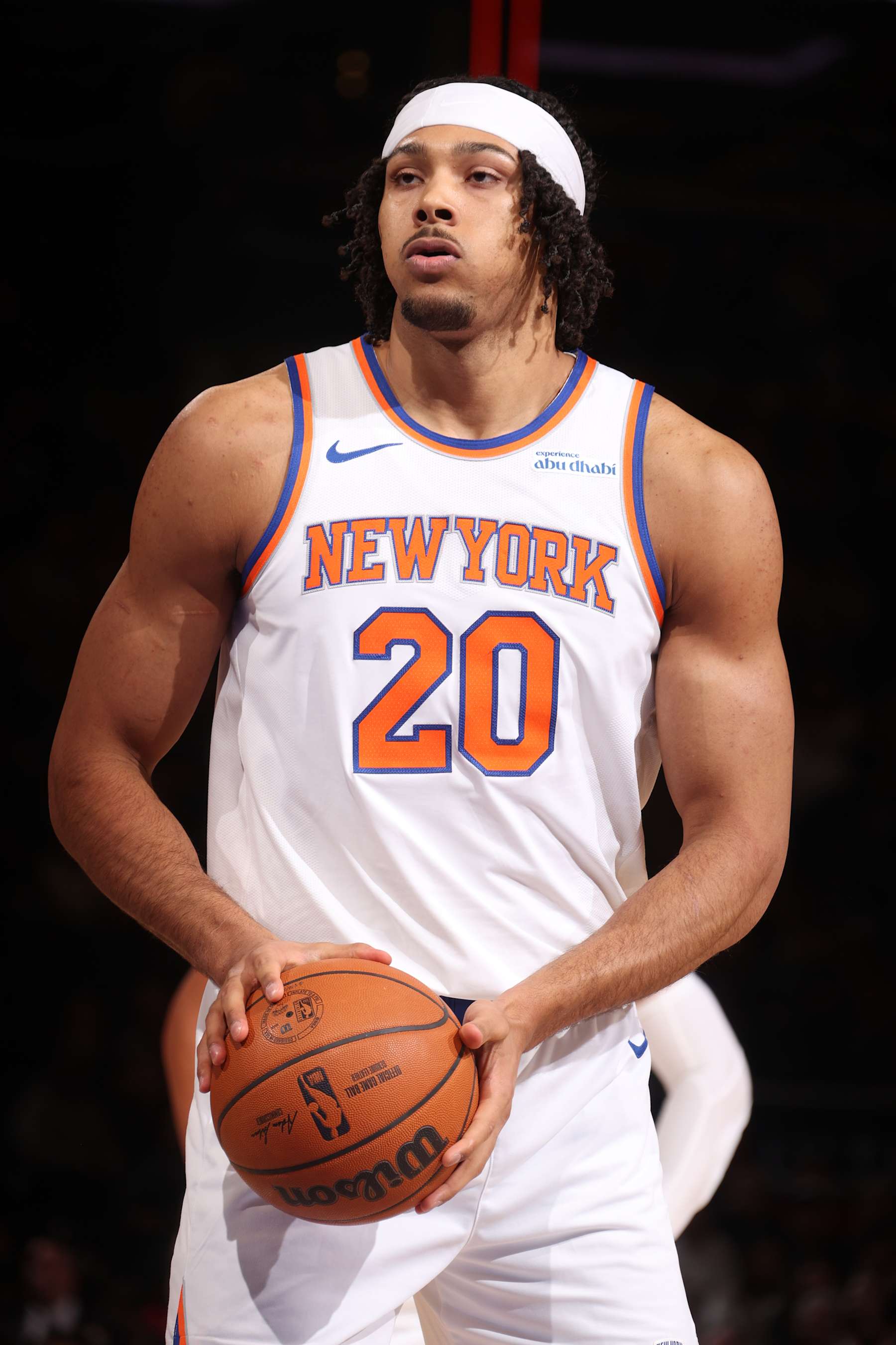 NEW YORK, NY - DECEMBER 23:  Jericho Sims #20 of the New York Knicks shoots a free throw during the game against the Toronto Raptors on December 23, 2024 at Madison Square Garden in New York City, New York.  NOTE TO USER: User expressly acknowledges and agrees that, by downloading and or using this photograph, User is consenting to the terms and conditions of the Getty Images License Agreement. Mandatory Copyright Notice: Copyright 2024 NBAE  (Photo by Nathaniel S. Butler/NBAE via Getty Images)
