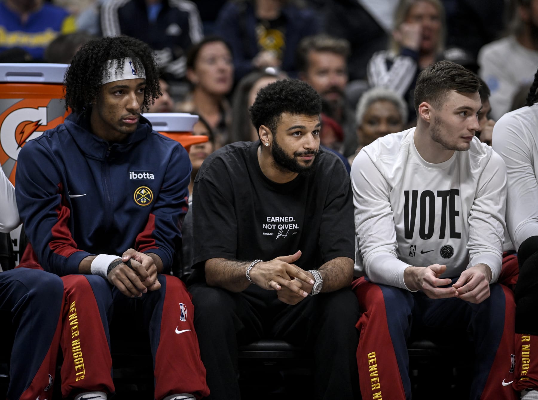DENVER, CO - NOVEMBER 6: Zeke Nnaji (22), Jamal Murray (27) and Christian Braun (0) of the Denver Nuggets sit on the bench during the first quarter against the New Orleans Pelicans at Ball Arena in Denver on Monday, November 6, 2023. (Photo by AAron Ontiveroz/The Denver Post)