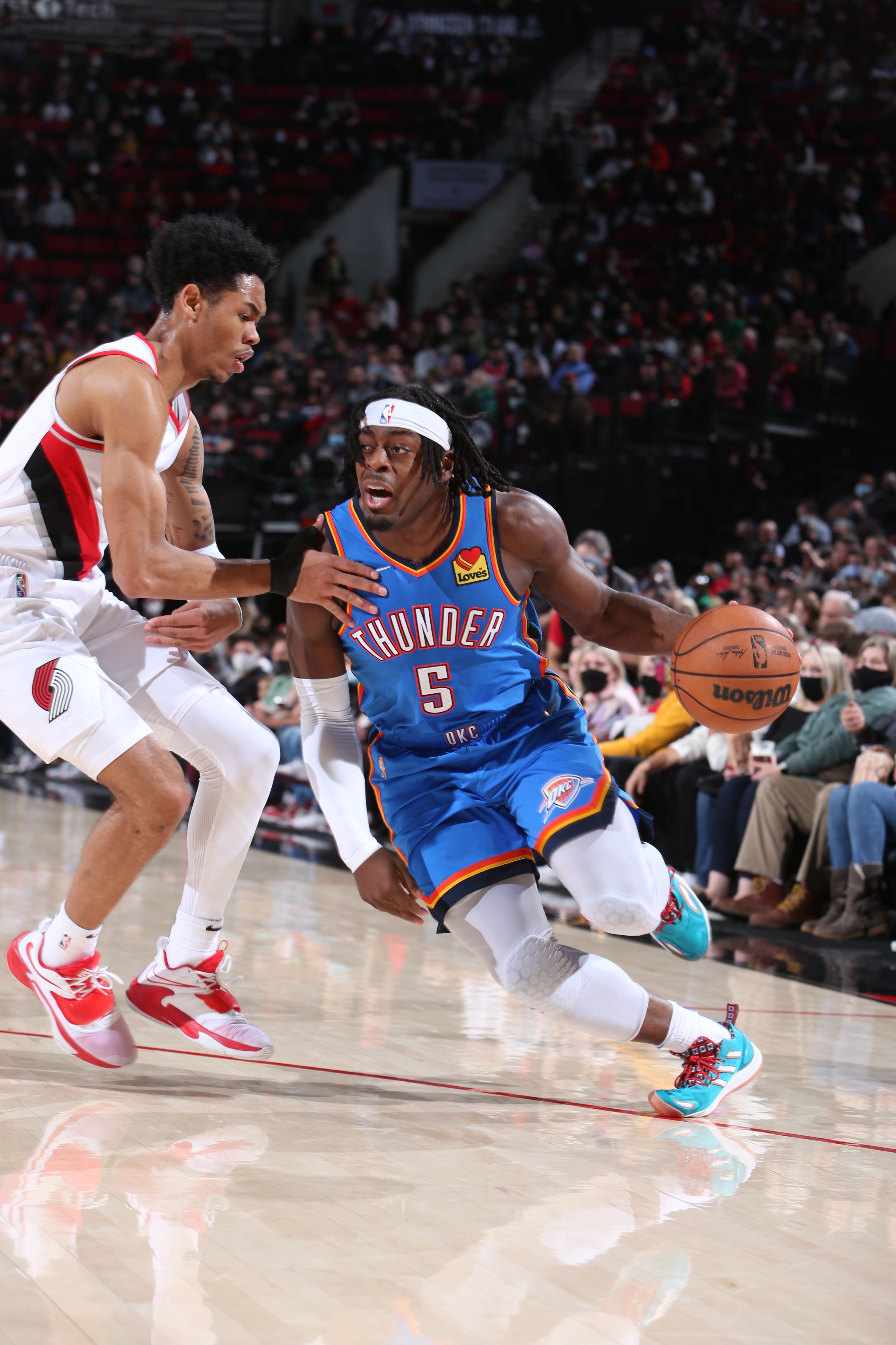 PORTLAND, OR - FEBRUARY 4: Luguentz Dort #5 of the Oklahoma City Thunder drives to the basket during the game against the Portland Trail Blazers on February 4, 2022 at the Moda Center Arena in Portland, Oregon. NOTE TO USER: User expressly acknowledges and agrees that, by downloading and or using this photograph, user is consenting to the terms and conditions of the Getty Images License Agreement. Mandatory Copyright Notice: Copyright 2022 NBAE (Photo by Sam Forencich/NBAE via Getty Images)