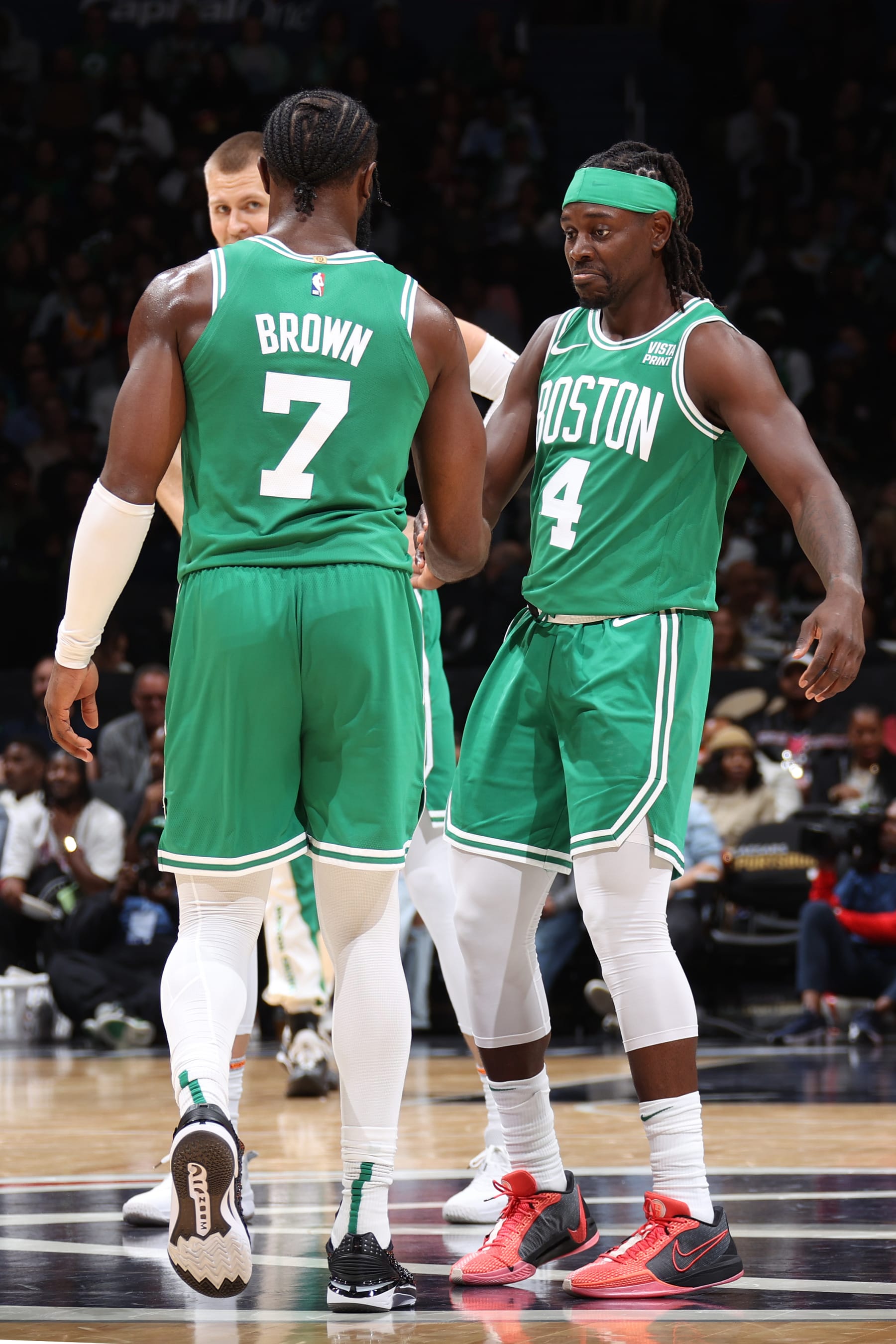 WASHINGTON, DC -  OCTOBER 30: Jaylen Brown #7 and Jrue Holiday #4 of the Boston Celtics high five during the game against the Washington Wizards on October 30, 2023 at Capital One Arena in Washington, DC. NOTE TO USER: User expressly acknowledges and agrees that, by downloading and or using this Photograph, user is consenting to the terms and conditions of the Getty Images License Agreement. Mandatory Copyright Notice: Copyright 2023 NBAE (Photo by Stephen Gosling/NBAE via Getty Images)