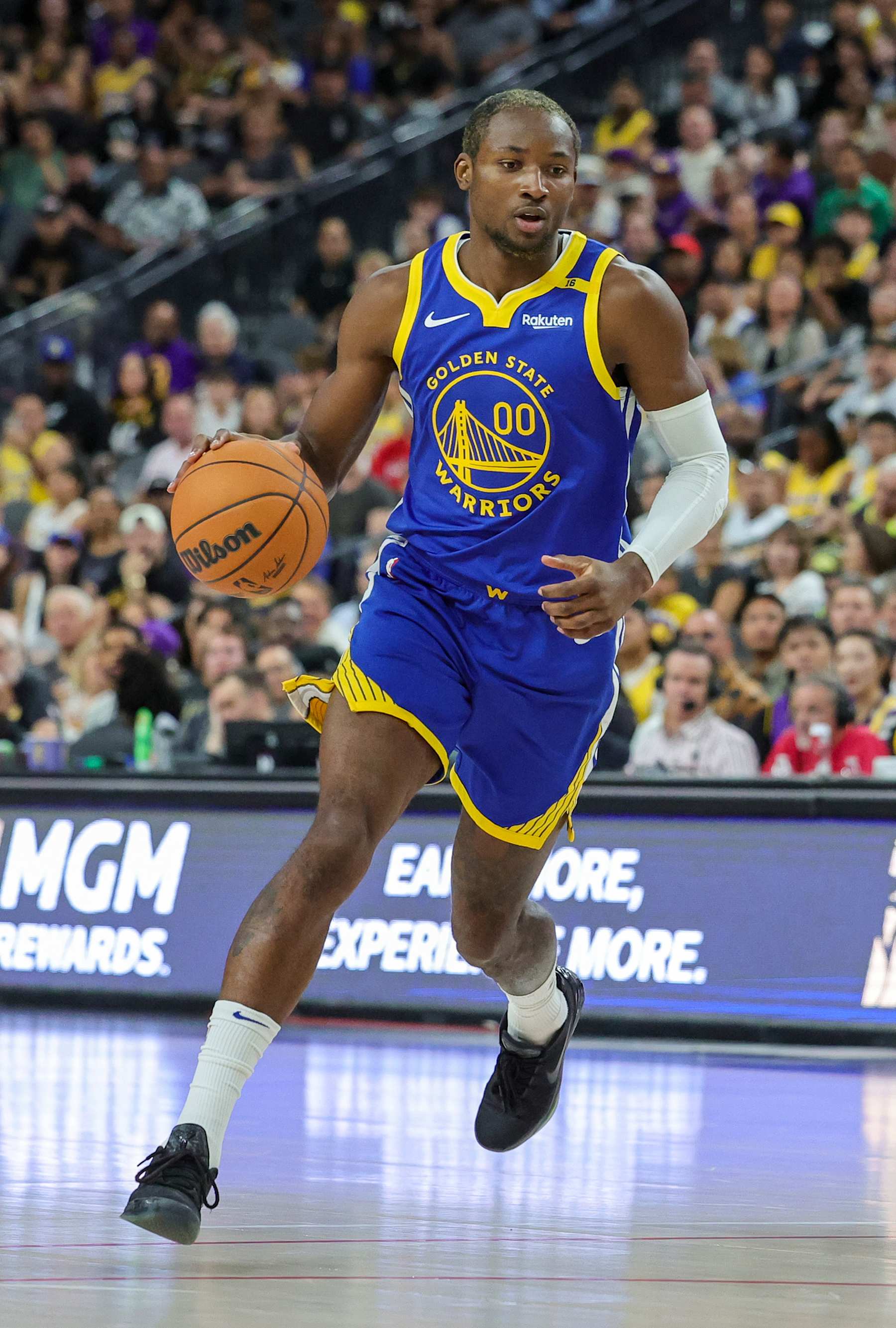 LAS VEGAS, NEVADA - OCTOBER 15: Jonathan Kuminga #00 of the Golden State Warriors brings the ball up the court against the Los Angeles Lakers in the first quarter of their preseason game at T-Mobile Arena at T-Mobile Arena on October 15, 2024 in Las Vegas, Nevada. The Warriors defeated the Lakers 111-97. NOTE TO USER: User expressly acknowledges and agrees that, by downloading and or using this photograph, User is consenting to the terms and conditions of the Getty Images License Agreement. (Photo by Ethan Miller/Getty Images)