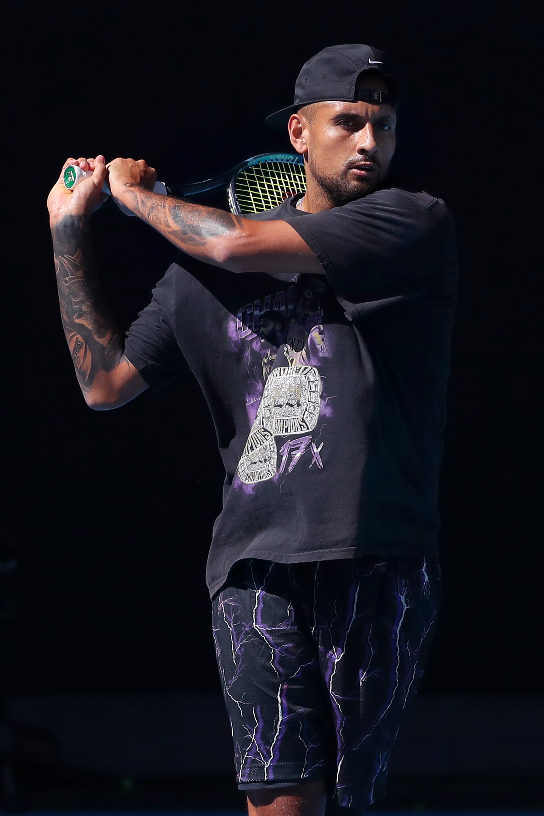 MELBOURNE, AUSTRALIA - JANUARY 14: Nick Kyrgios of Australia plays a backhand during a practice session ahead of the 2023 Australian Open at Melbourne Park on January 14, 2023 in Melbourne, Australia. (Photo by Kelly Defina/Getty Images)