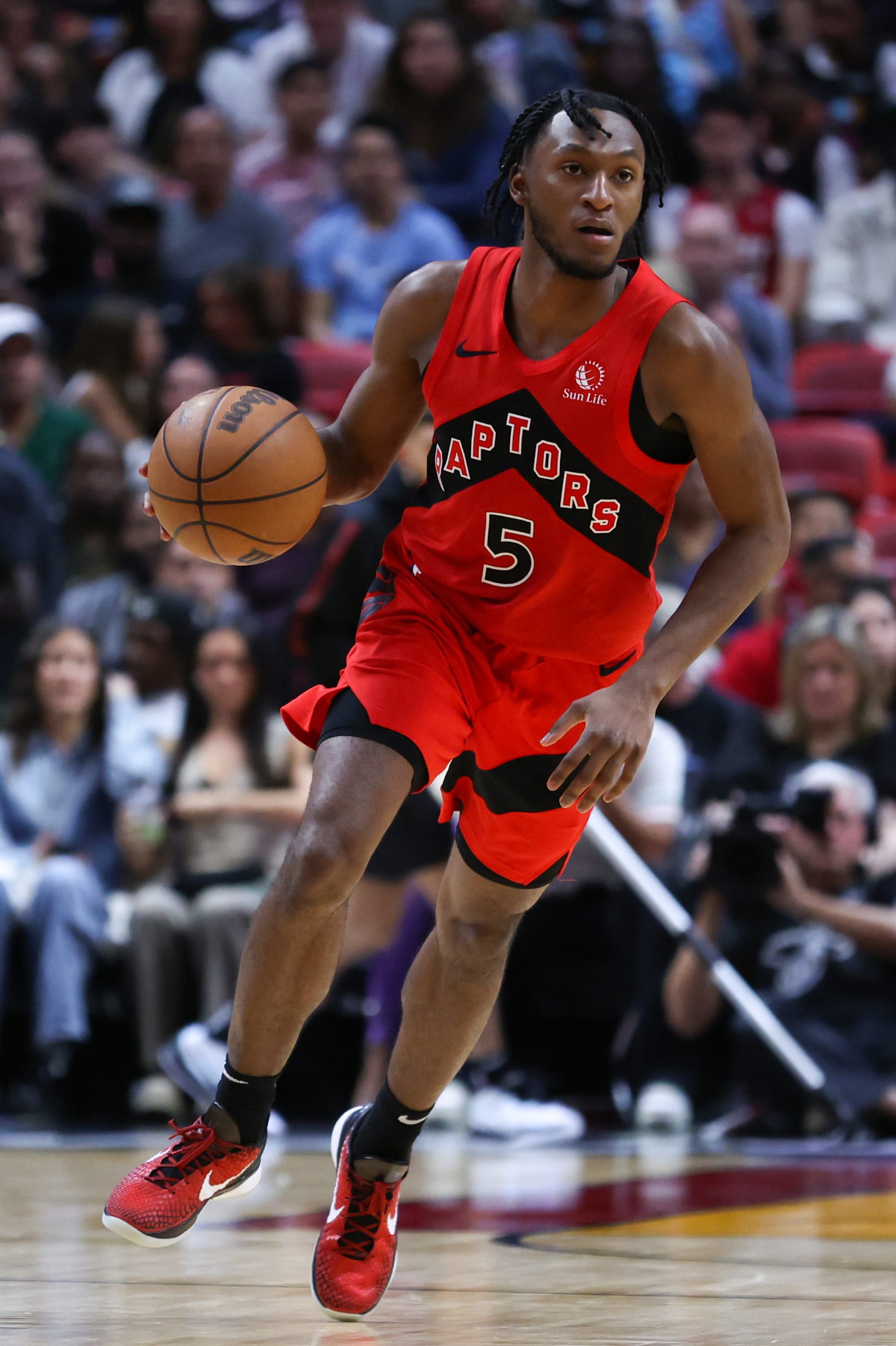 MIAMI, FLORIDA - APRIL 12: Immanuel Quickley #5 of the Toronto Raptors dribbles the ball against the Miami Heat during the fourth quarter of the game at Kaseya Center on April 12, 2024 in Miami, Florida. NOTE TO USER: User expressly acknowledges and agrees that, by downloading and or using this photograph, User is consenting to the terms and conditions of the Getty Images License Agreement. (Photo by Megan Briggs/Getty Images)