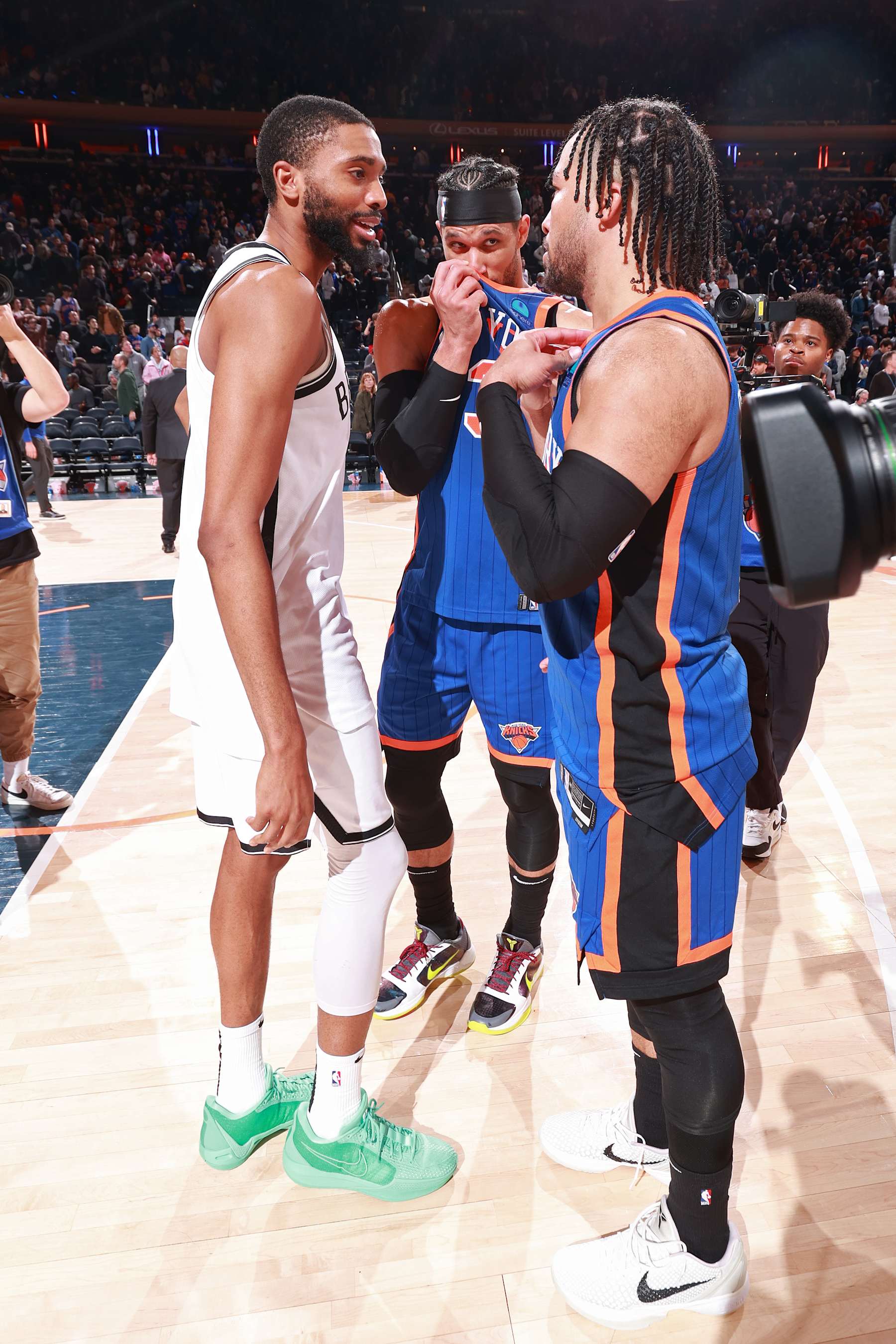 NEW YORK, NY - MARCH 23: Jalen Brunson #11 and Josh Hart #3 of the New York Knicks talk to Mikal Bridges #1 of the Brooklyn Nets after the game on March 23, 2024 at Madison Square Garden in New York City, New York.  NOTE TO USER: User expressly acknowledges and agrees that, by downloading and or using this photograph, User is consenting to the terms and conditions of the Getty Images License Agreement. Mandatory Copyright Notice: Copyright 2024 NBAE  (Photo by Nathaniel S. Butler/NBAE via Getty Images)