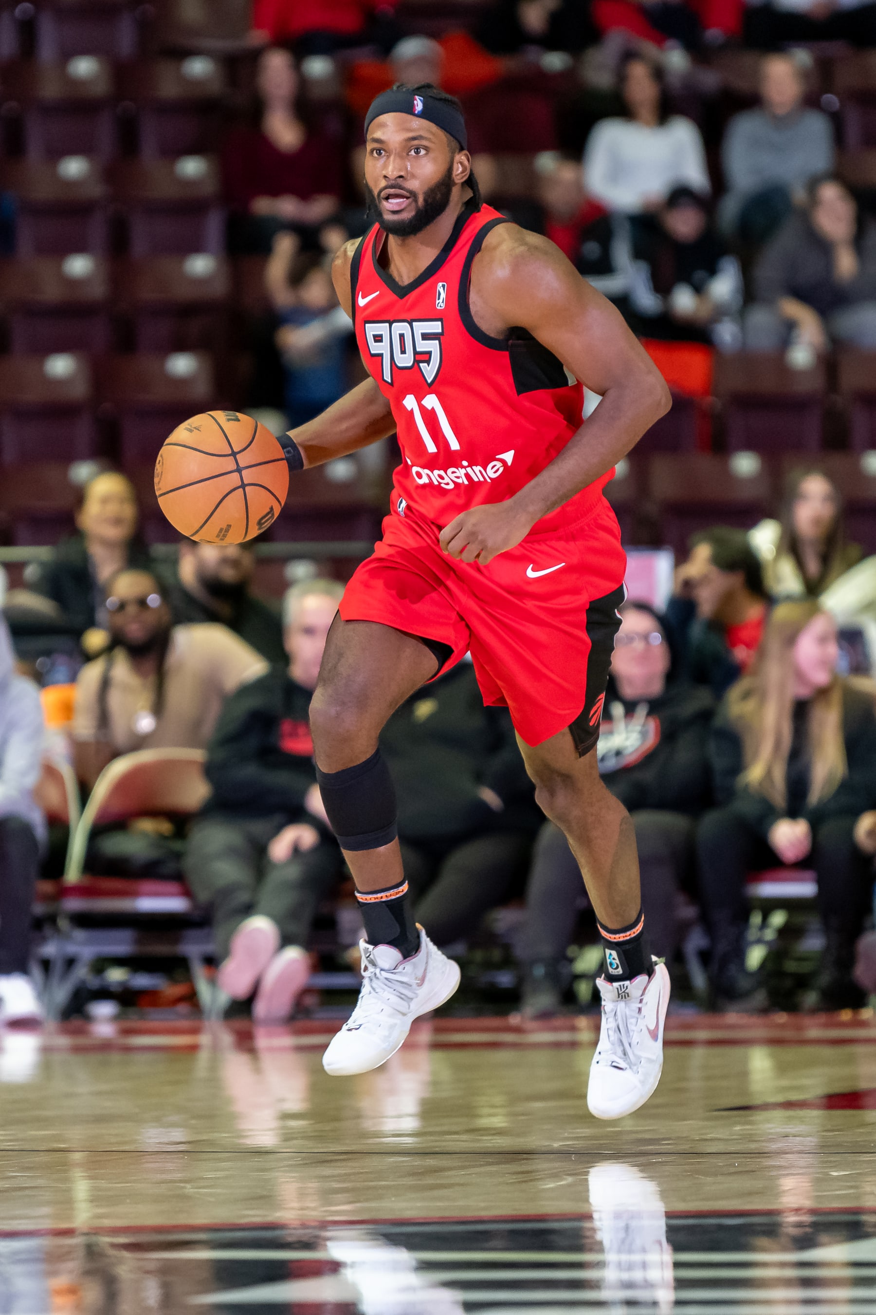 MISSISSAUGA, ON - DECEMBER 14: Justise Winslow #11 of the Raptors 905 handles the ball during an NBA G League game against the Delaware Blue Coats at the Paramount Fine Foods Centre on December 14th, 2023 in Mississauga, Ontario. NOTE TO USER: User expressly acknowledges and agrees that, by downloading and/or using this photograph, user is consenting to the terms and conditions of the Getty Images License Agreement. Mandatory Copyright Notice: Copyright 2023 NBAE (Photo by Christian Bonin/NBAE via Getty Images)