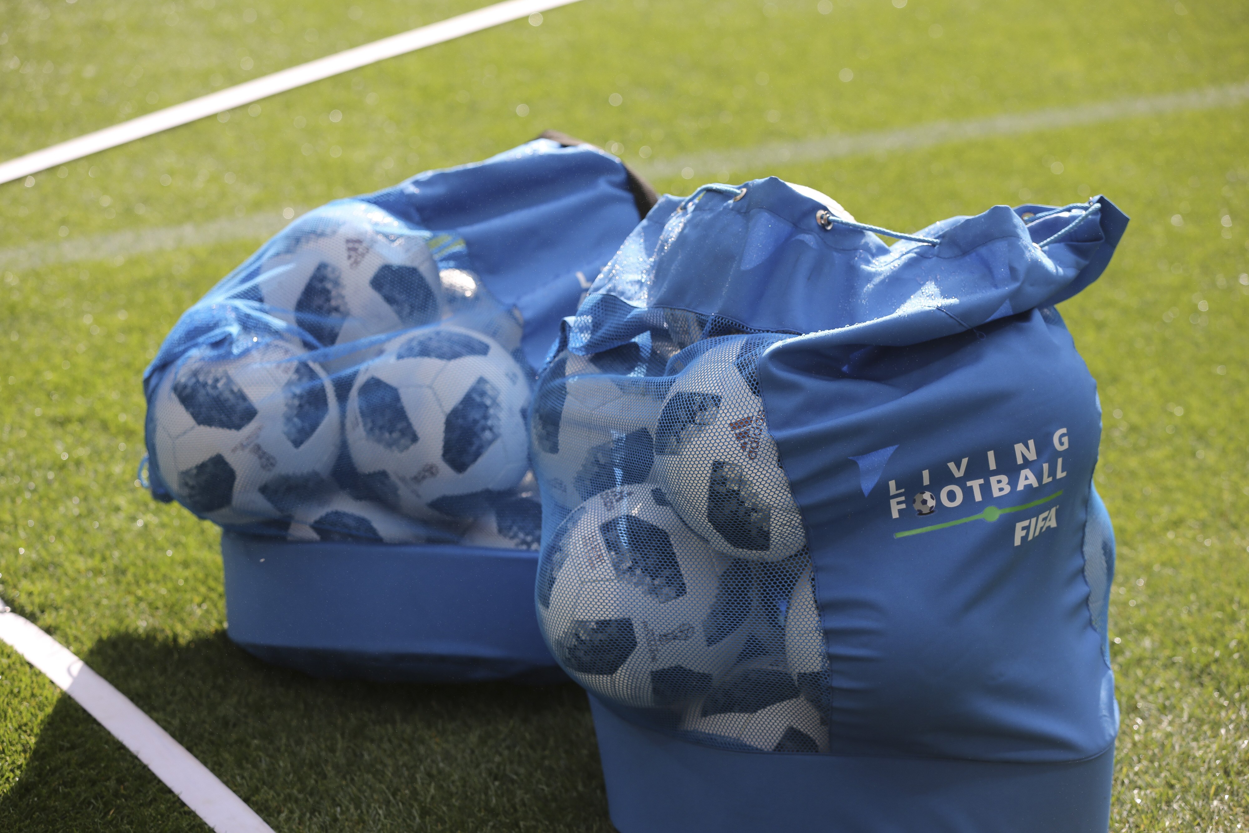 Practice soccer balls sit on the pitch in ball bags during preparations ahead of the FIFA World Cup opening ceremony at the Luzhniki stadium in Moscow, Russia, on Wednesday, June 13, 2018. According to an April report from the organizing committee, the total amount spent on preparations is 683 billion rubles, or about $11 billion at the current exchange rate. Photographer: Andrey Rudakov/Bloomberg via Getty Images