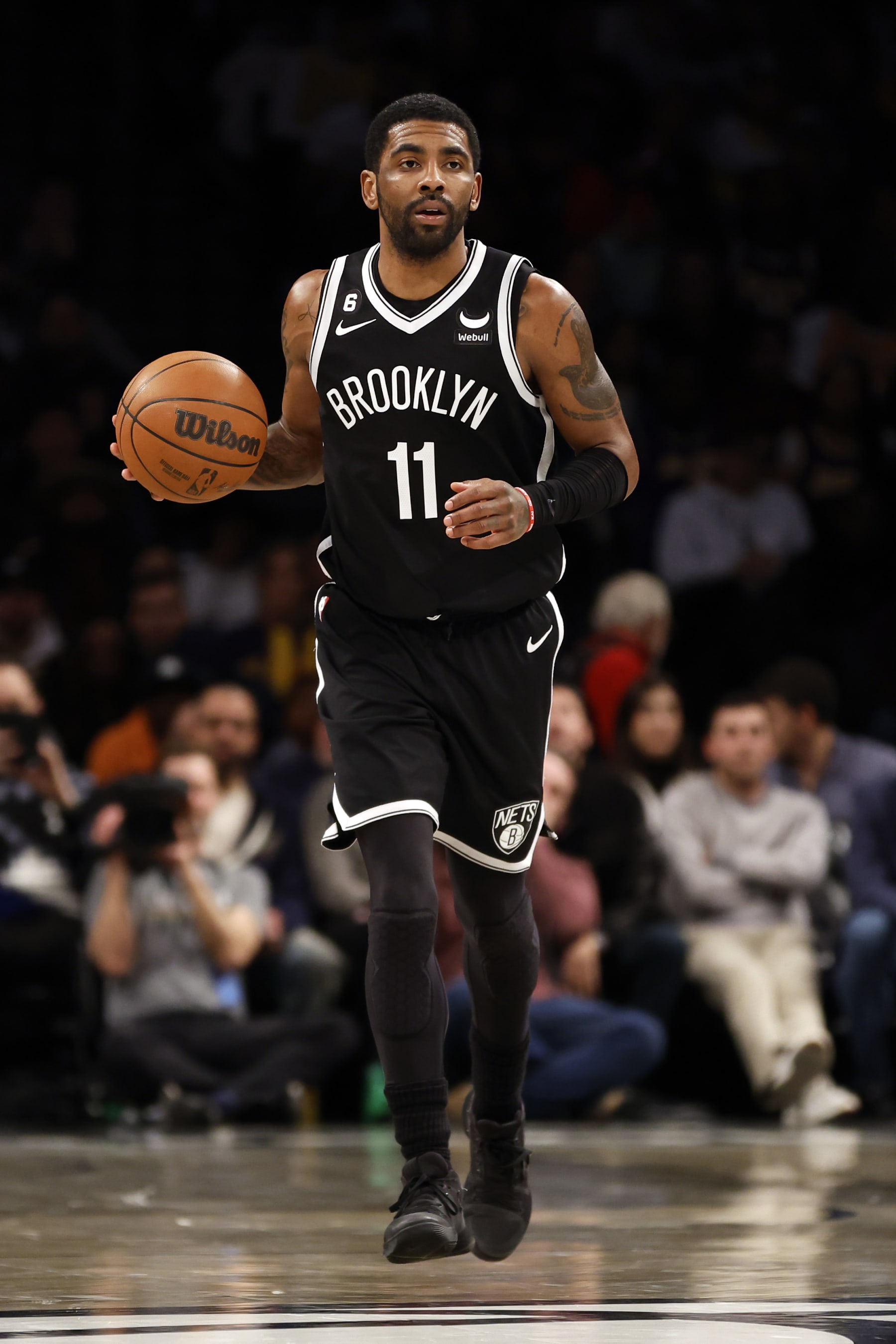 NEW YORK, NEW YORK - JANUARY 30: Kyrie Irving #11 of the Brooklyn Nets dribbles during the second half against the Los Angeles Lakers at Barclays Center on January 30, 2023 in the Brooklyn borough of New York City. The Nets won 121-104. NOTE TO USER: User expressly acknowledges and agrees that, by downloading and/or using this photograph, User is consenting to the terms and conditions of the Getty Images License Agreement. (Photo by Sarah Stier/Getty Images)