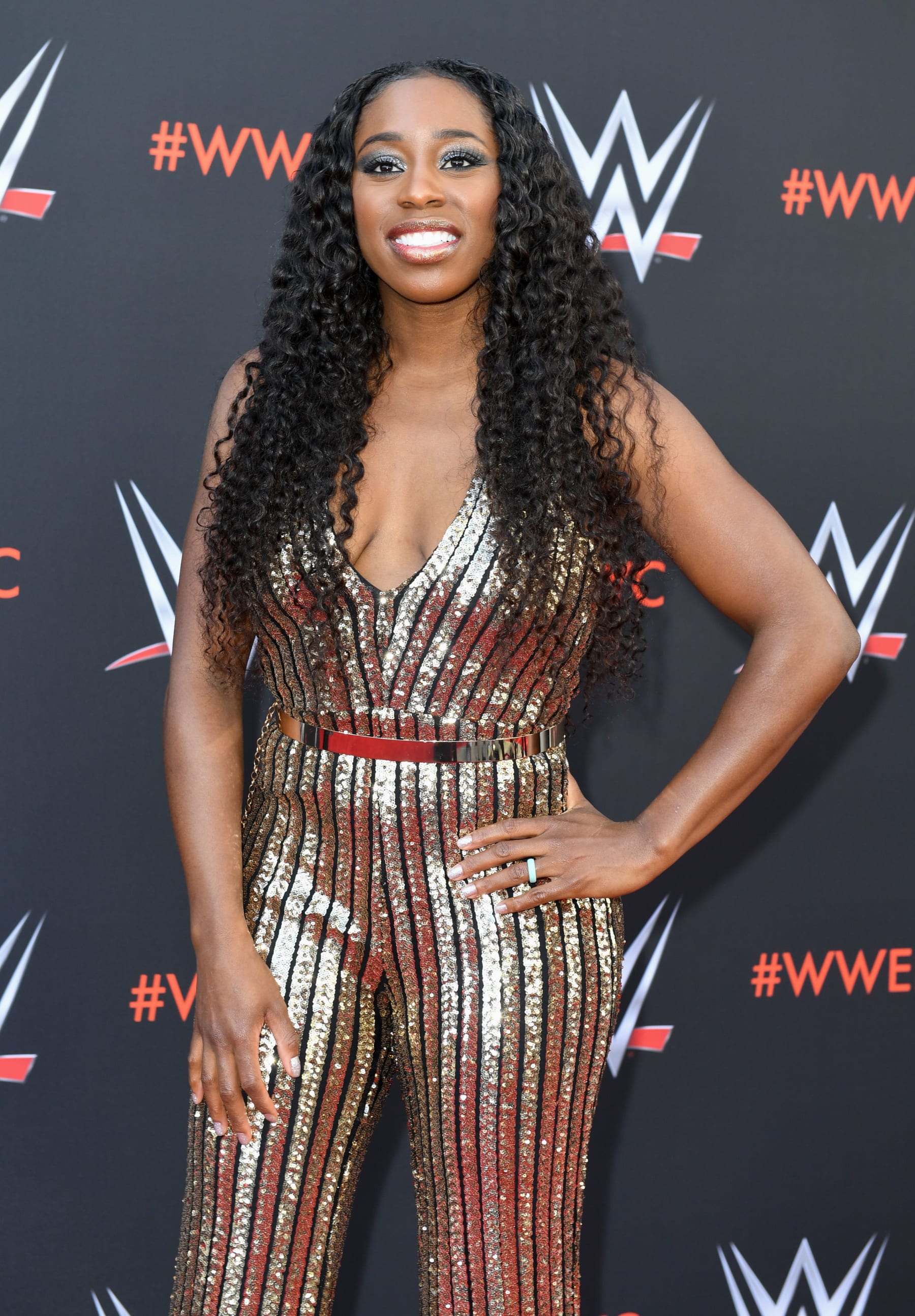 Pro wrestler Naomi arrives at the first-ever WWE Emmy For Your Consideration event at the TV Academy Saban Media Center, in North Hollywood (near Los Angeles), on June 6, 2018 (Photo by VALERIE MACON / AFP) (Photo credit should read VALERIE MACON/AFP via Getty Images) Pro wrestler Naomi arrives at the first-ever WWE Emmy For Your Consideration event at the TV Academy Saban Media Center, in North Hollywood (near Los Angeles), on June 6, 2018 (Photo by VALERIE MACON / AFP) (Photo credit should read VALERIE MACON/AFP via Getty Images)