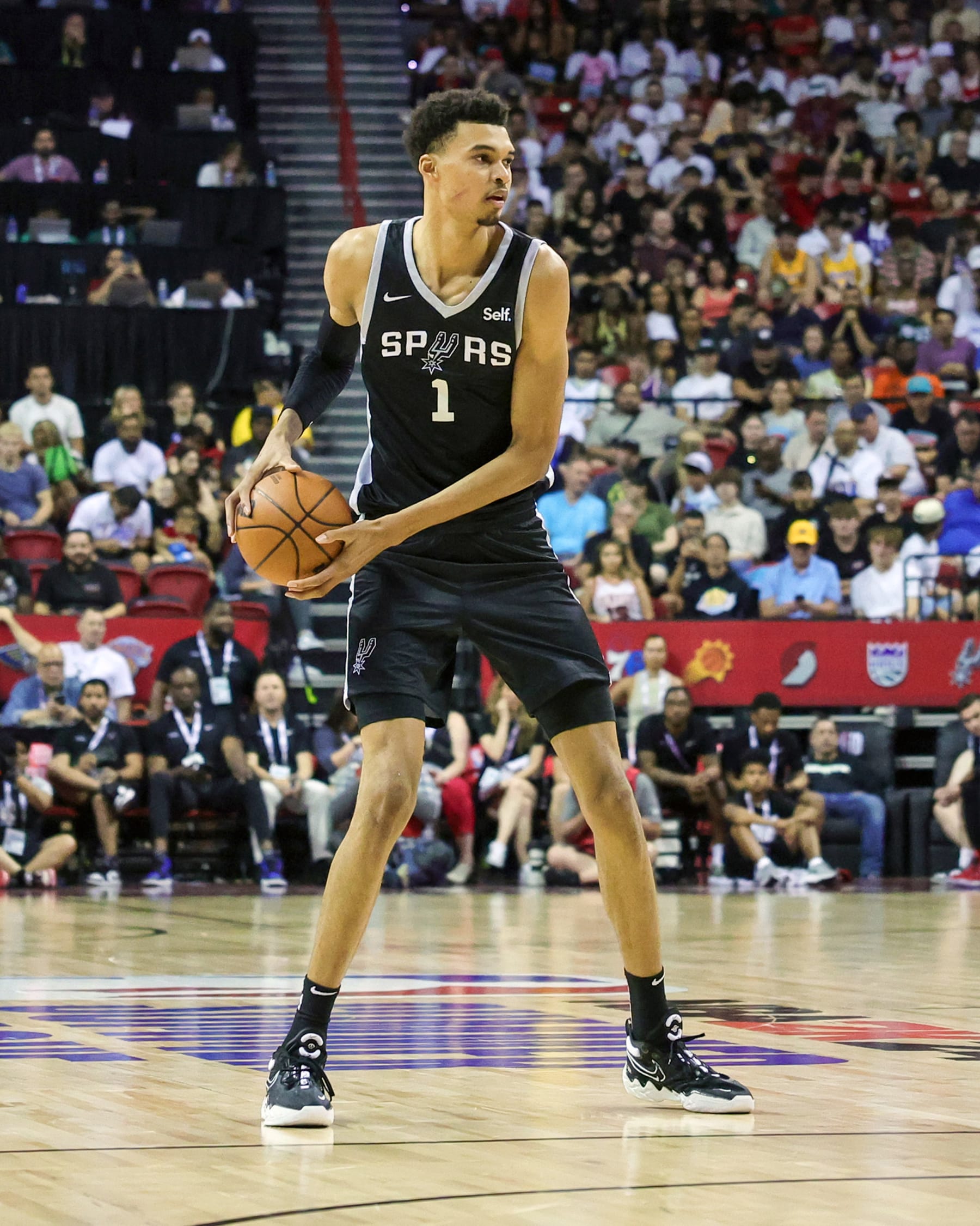 LAS VEGAS, NEVADA - JULY 09: Victor Wembanyama #1 of the San Antonio Spurs looks to pass against the Portland Trail Blazers in the second half of a 2023 NBA Summer League game at the Thomas & Mack Center on July 09, 2023 in Las Vegas, Nevada. NOTE TO USER: User expressly acknowledges and agrees that, by downloading and or using this photograph, User is consenting to the terms and conditions of the Getty Images License Agreement. (Photo by Ethan Miller/Getty Images)