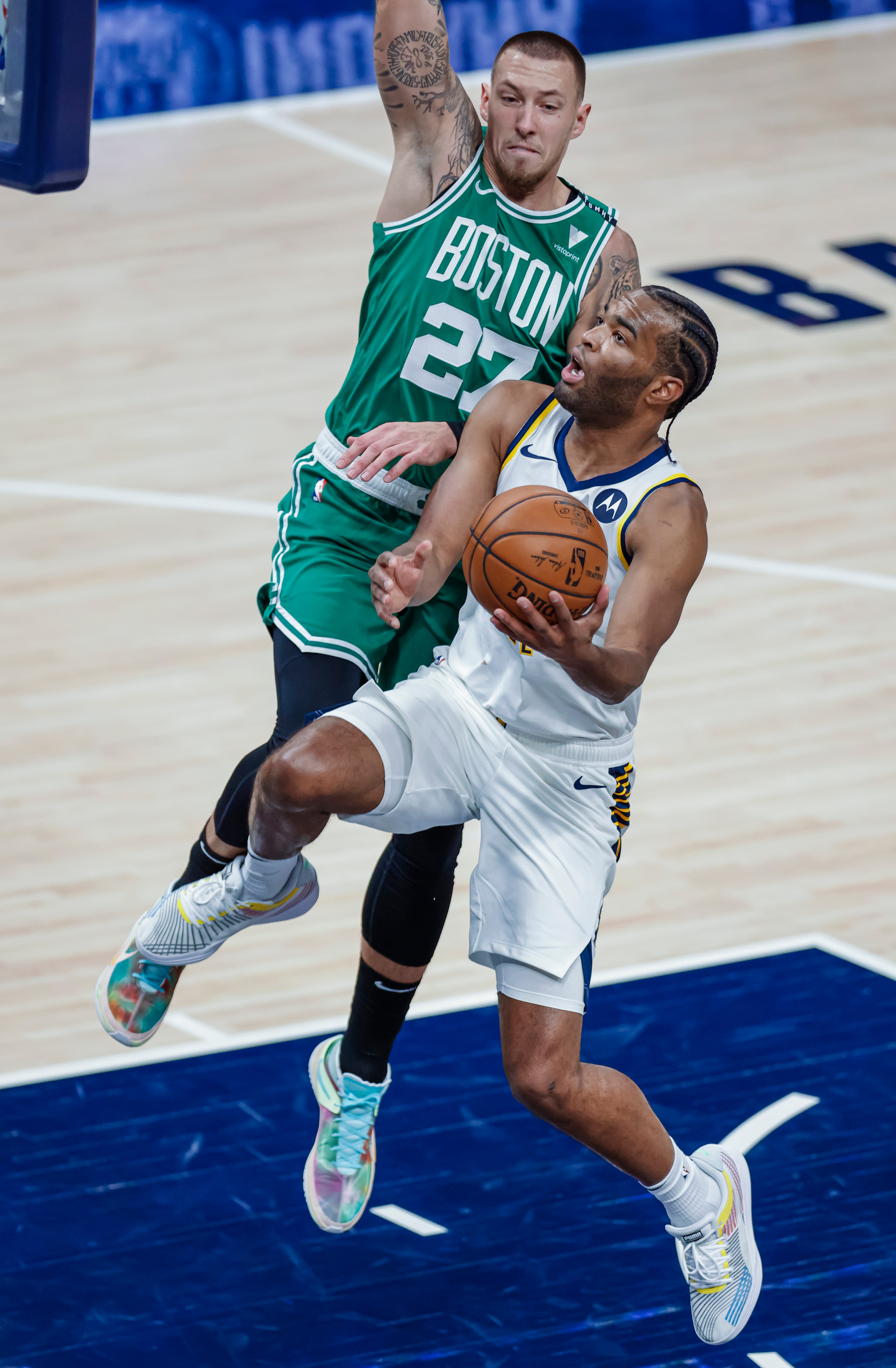 INDIANAPOLIS, IN - DECEMBER 29: T.J. Warren #1 of the Indiana Pacers shoots the ball against Daniel Theis #27 of the Boston Celtics during the game at Bankers Life Fieldhouse on December 29, 2020 in Indianapolis, Indiana. NOTE TO USER: User expressly acknowledges and agrees that, by downloading and or using this photograph, User is consenting to the terms and conditions of the Getty Images License Agreement. (Photo by Michael Hickey/Getty Images)
