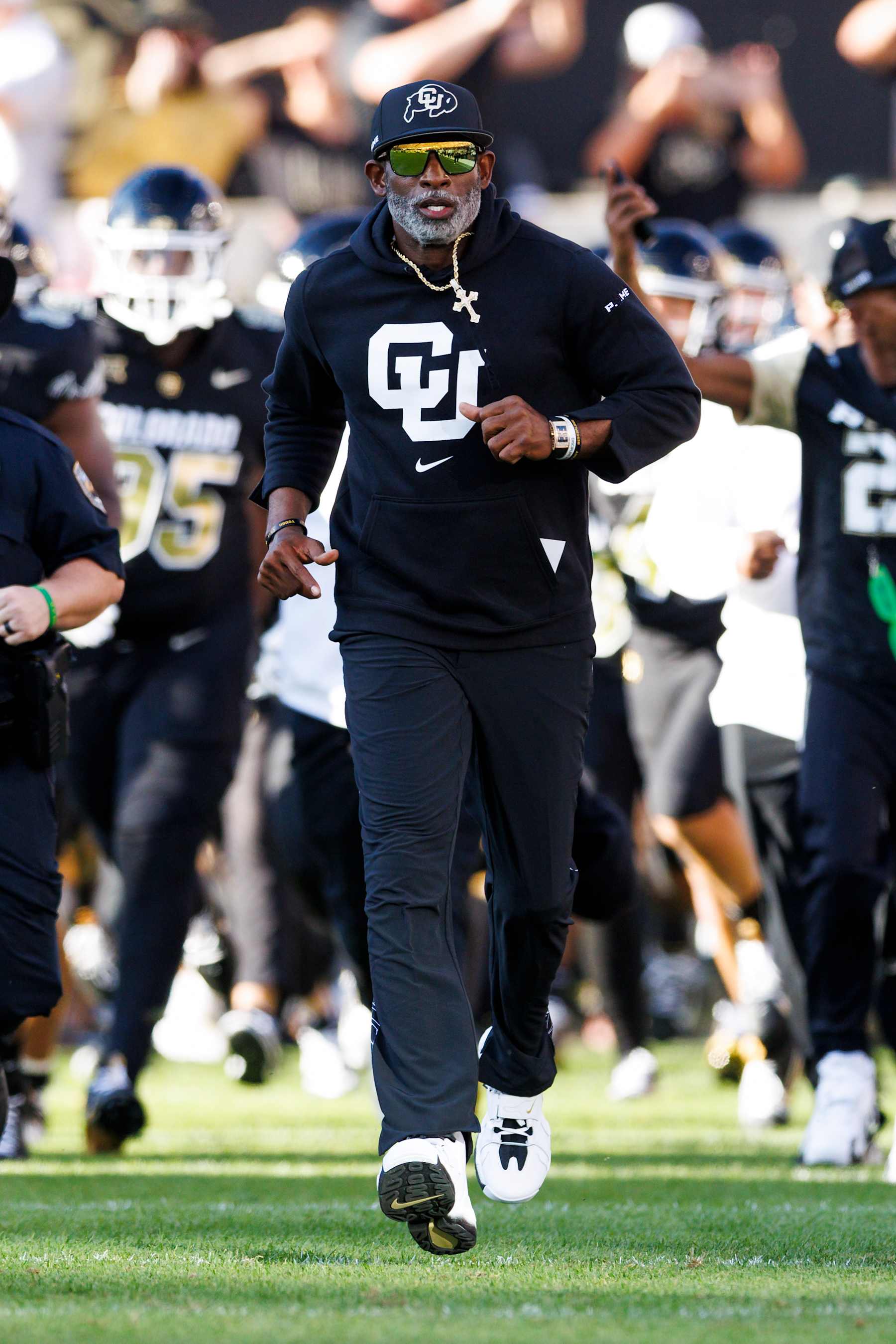 BOULDER, COLORADO - AUGUST 29: Deion Sanders of the Colorado Buffaloes runs onto the field before a game against North Dakota State Bison at Folsom Field on August 29, 2024 in Boulder, Colorado. (Photo by Ric Tapia/Getty Images)