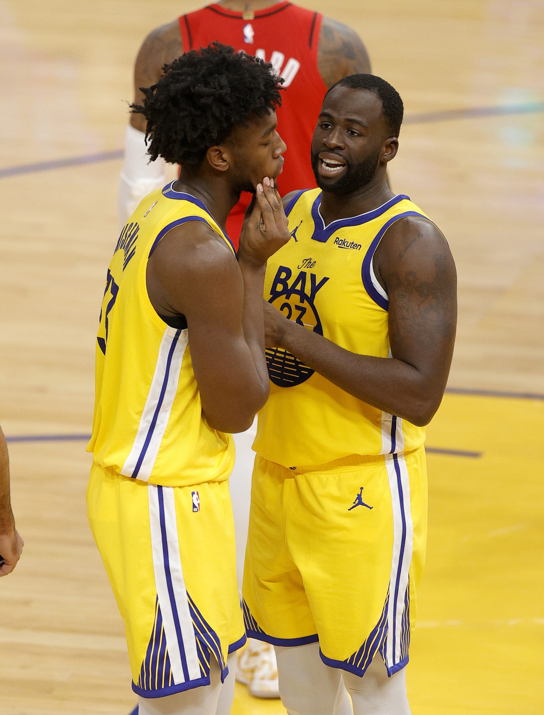 SAN FRANCISCO, CALIFORNIA - JANUARY 03:  Draymond Green #23 talks to James Wiseman #33 of the Golden State Warriors reacts after Wiseman was called for his third foul against the Portland Trail Blazers at Chase Center on January 03, 2021 in San Francisco, California. NOTE TO USER: User expressly acknowledges and agrees that, by downloading and or using this photograph, User is consenting to the terms and conditions of the Getty Images License Agreement.  (Photo by Ezra Shaw/undefined)