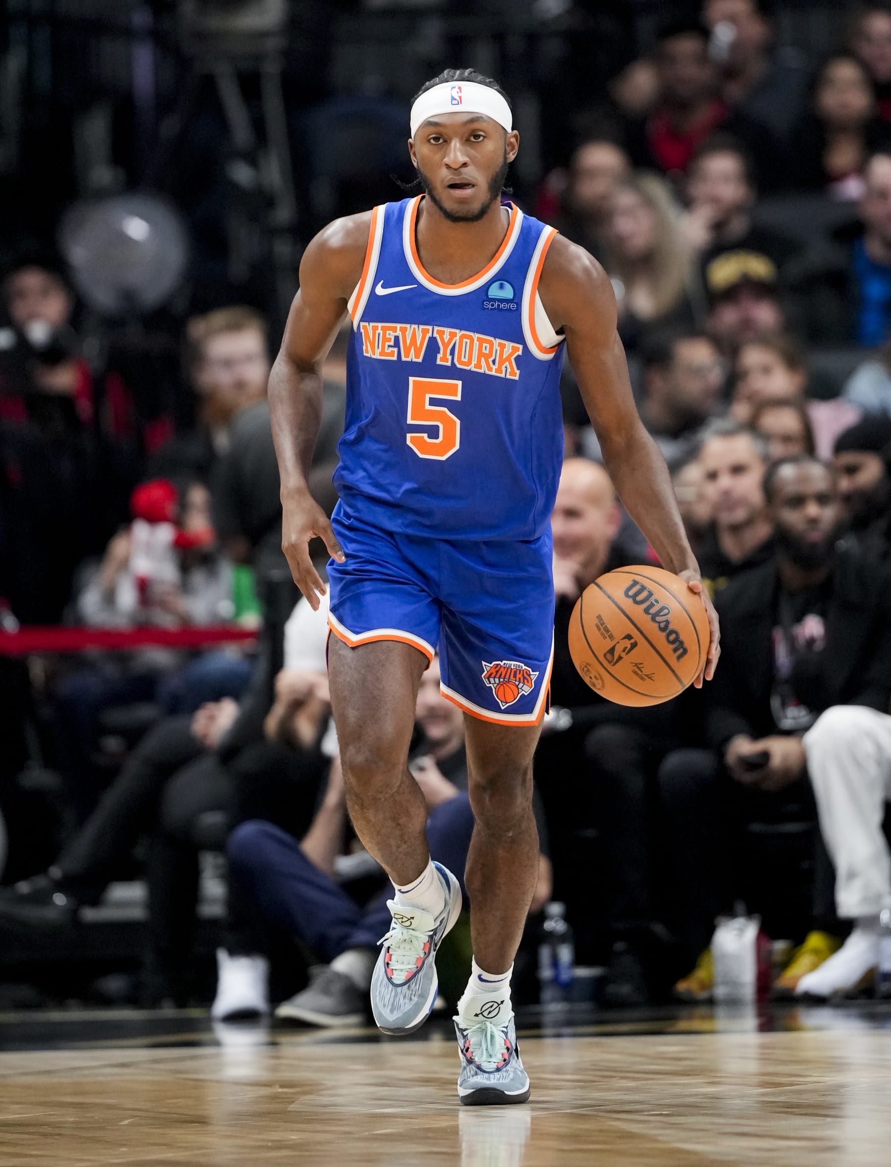 TORONTO, ON - DECEMBER 1: Immanuel Quickley #5 of the New York Knicks dribbles against the Toronto Raptors during the first half of their basketball game at the Scotiabank Arena on December 1, 2023 in Toronto, Ontario, Canada. NOTE TO USER: User expressly acknowledges and agrees that, by downloading and/or using this Photograph, user is consenting to the terms and conditions of the Getty Images License Agreement. (Photo by Mark Blinch/Getty Images)