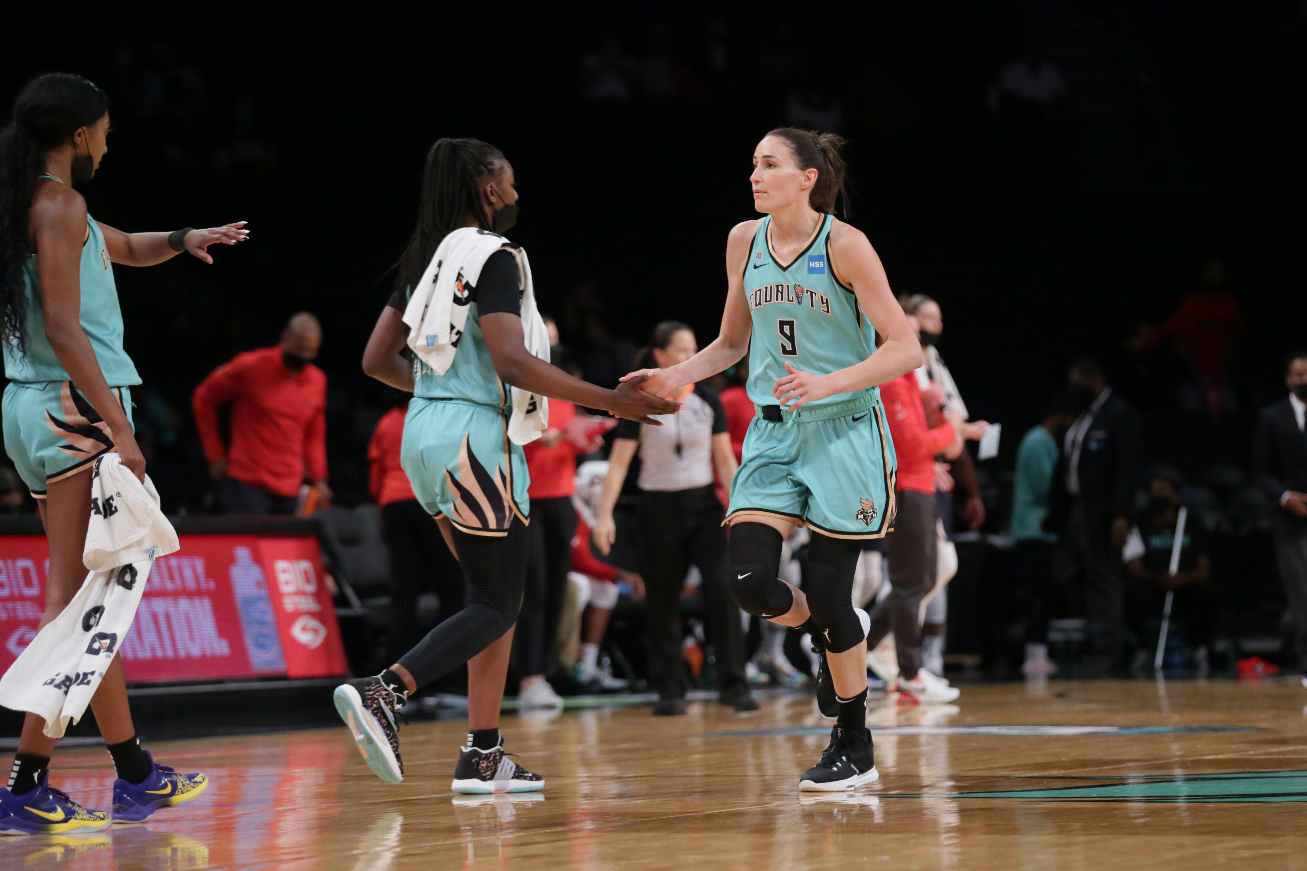 BROOKLYN, NY - SEPTEMBER 17: Rebecca Allen #9 of the New York Liberty high-fives teammates during the game against the Washington Mystics on September 17, 2021 at Barclays Center in Brooklyn, New York. NOTE TO USER: User expressly acknowledges and agrees that, by downloading and or using this photograph, User is consenting to the terms and conditions of the Getty Images License Agreement. Mandatory Copyright Notice: Copyright 2021 NBAE (Photo by Steven Freeman/NBAE via Getty Images)