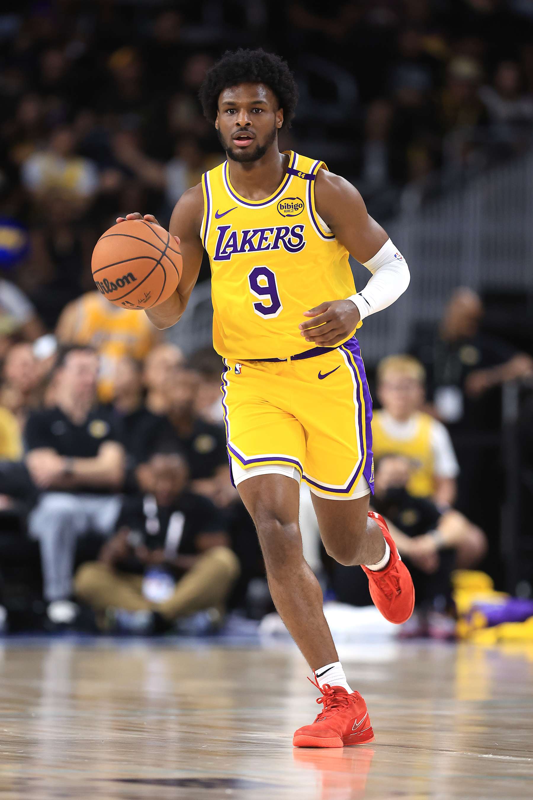 PALM SPRINGS, CALIFORNIA - OCTOBER 04: Bronny James #9 of the Los Angeles Lakers dribbles upcourt during the first half of a game against the Minnesota Timberwolves at Acrisure Arena on October 04, 2024 in Palm Springs, California.  (Photo by Sean M. Haffey/Getty Images)