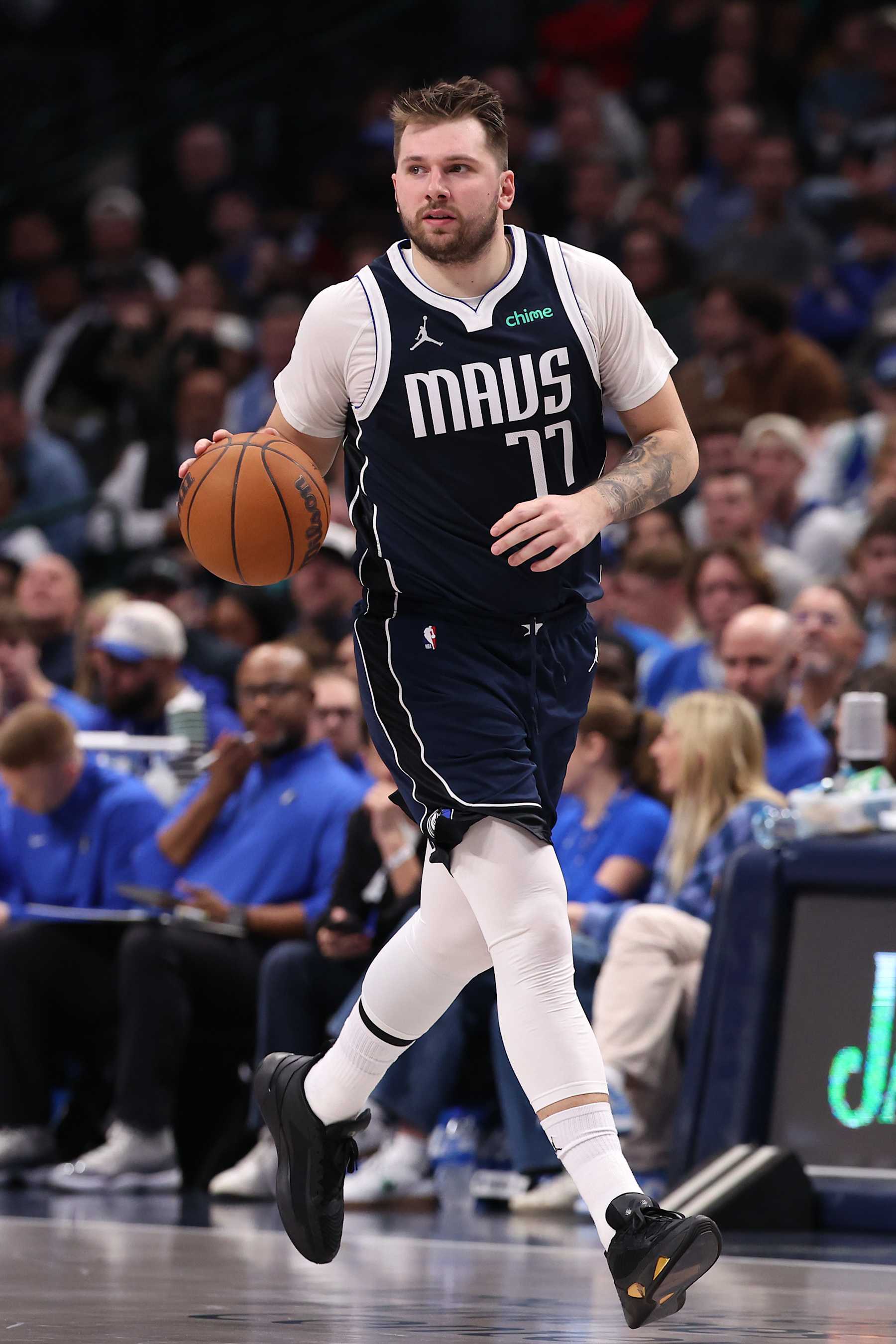 DALLAS, TEXAS - DECEMBER 23: Luka Doncic #77 of the Dallas Mavericks brings the ball up court during the first half against the Portland Trail Blazers at American Airlines Center on December 23, 2024 in Dallas, Texas. NOTE TO USER: User expressly acknowledges and agrees that, by downloading and/or using this photograph, user is consenting to the terms and conditions of the Getty Images License Agreement. (Photo by Sam Hodde/Getty Images)