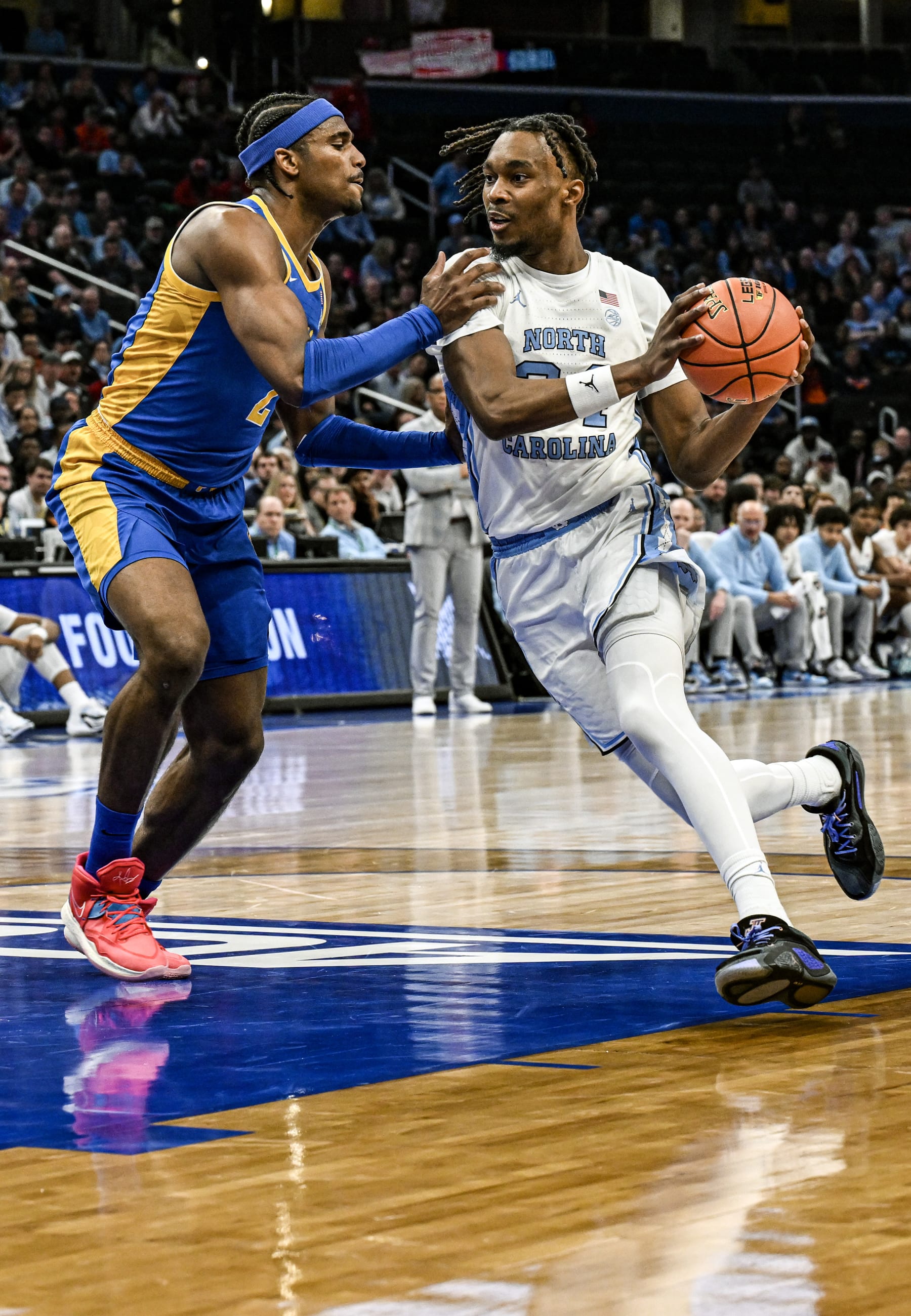 WASHINGTON, DC - MARCH 15: North Carolina Tar Heels forward Jae'Lyn Withers (24) in action against Pittsburgh Panthers forward Blake Hinson (2) in the first game of the ACC Tournament Semi Final on March 15, 2024 at the Capital One Arena in Washington, D.C.  (Photo by Mark Goldman/Icon Sportswire via Getty Images)
