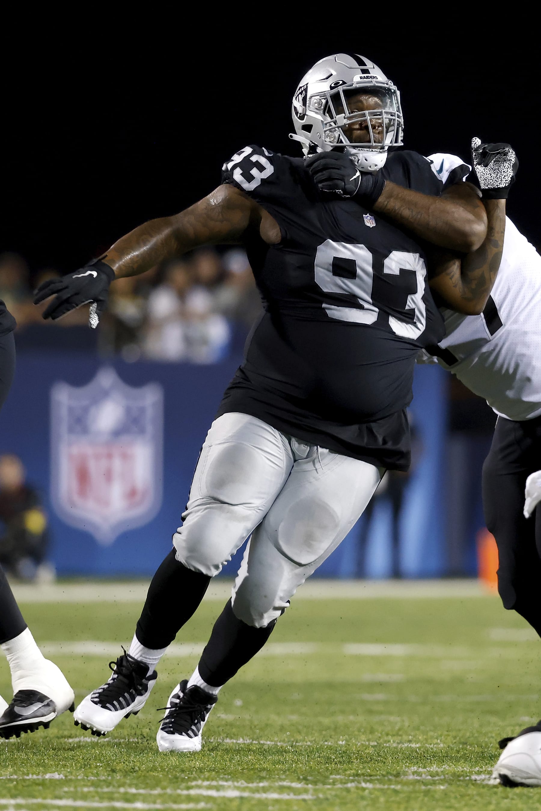 Las Vegas Raiders defensive tackle Neil Farrell Jr. (93) is blocked running off of the line of scrimmage during an NFL preseason football game against the Jacksonville Jaguars, Thursday, Aug. 4, 2022, in Canton, Ohio. (AP Photo/Kirk Irwin) Las Vegas Raiders defensive tackle Neil Farrell Jr. (93) is blocked running off of the line of scrimmage during an NFL preseason football game against the Jacksonville Jaguars, Thursday, Aug. 4, 2022, in Canton, Ohio. (AP Photo/Kirk Irwin)