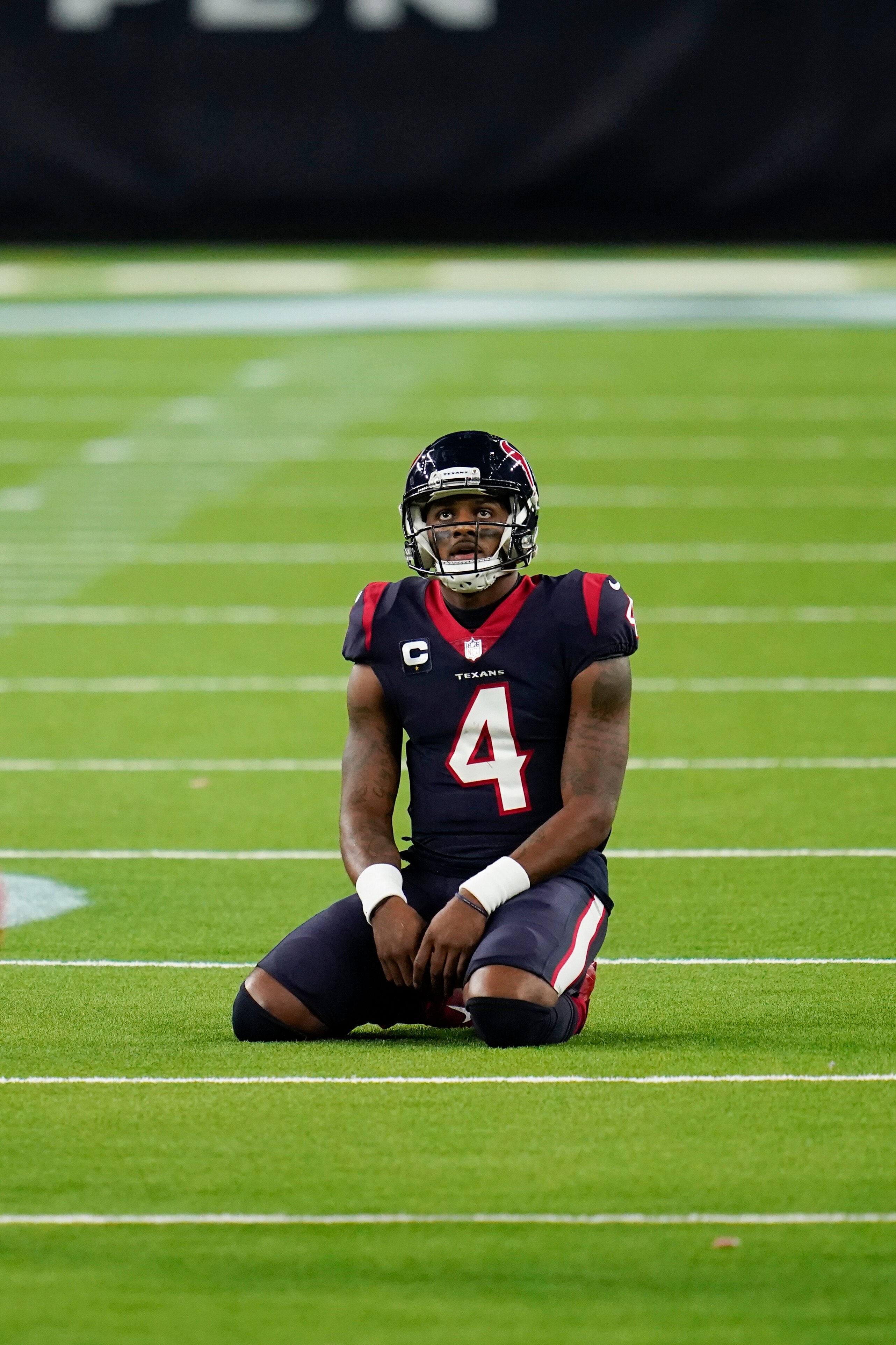 Houston Texans quarterback Deshaun Watson (4) kneels / sits on the field in frustration during an NFL football game against the Tennessee Titans, Sunday, Jan. 3, 2021, in Houston. (AP Photo/Matt Patterson)