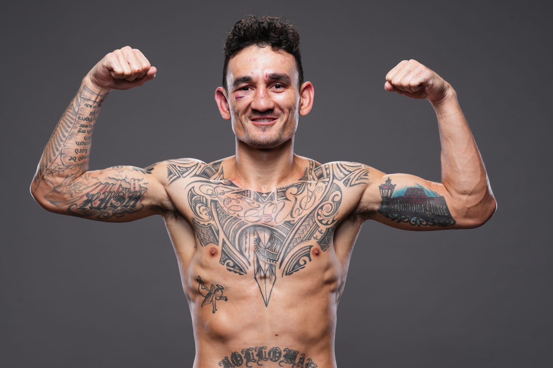KANSAS CITY, MISSOURI - APRIL 15: Max Holloway poses for a post fight portrait backstage during the UFC Fight Night event at T-Mobile Center on April 15, 2023 in Kansas City, Missouri. (Photo by Mike Roach/Zuffa LLC via Getty Images)