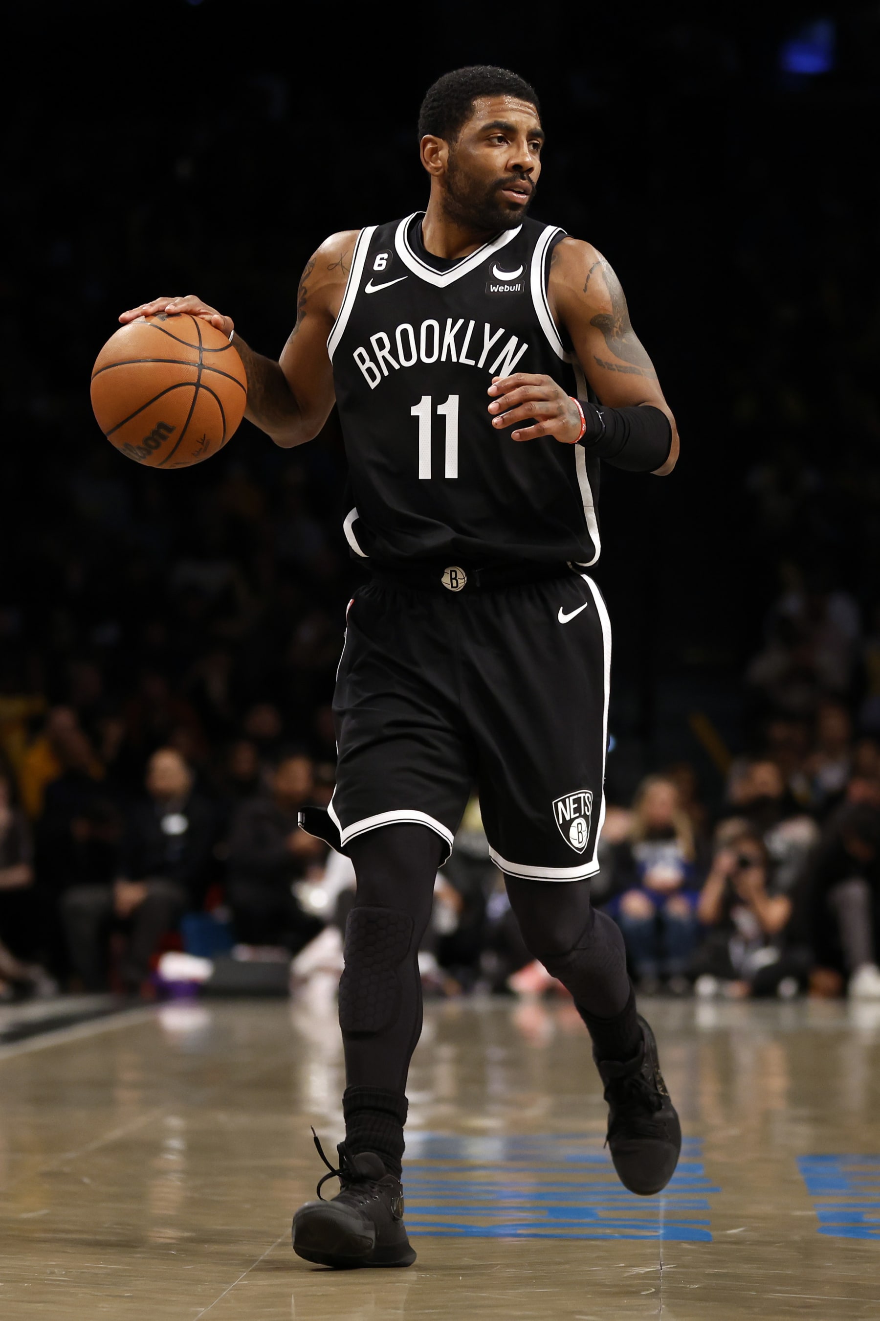 NEW YORK, NEW YORK - JANUARY 30: Kyrie Irving #11 of the Brooklyn Nets dribbles during the second half against the Los Angeles Lakers at Barclays Center on January 30, 2023 in the Brooklyn borough of New York City. The Nets won 121-104. NOTE TO USER: User expressly acknowledges and agrees that, by downloading and/or using this photograph, User is consenting to the terms and conditions of the Getty Images License Agreement. (Photo by Sarah Stier/Getty Images)