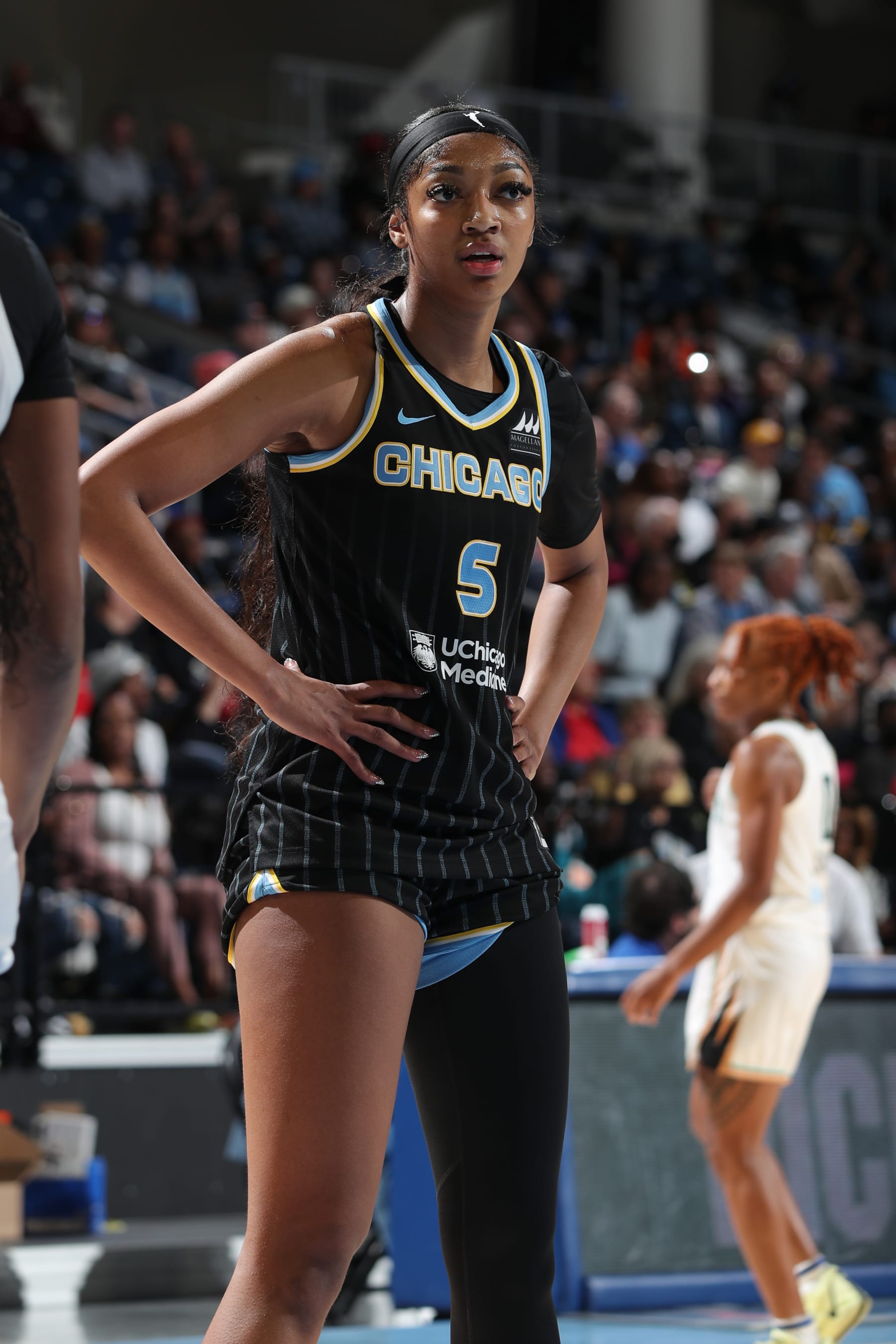 CHICAGO, IL -  MAY 7:  Angel Reese #5 of the Chicago Sky looks on during the game against the New York Liberty during the WNBA preseason game on May 7, 2024 at the Wintrust Arena in Chicago, IL. NOTE TO USER: User expressly acknowledges and agrees that, by downloading and or using this photograph, User is consenting to the terms and conditions of the Getty Images License Agreement. Mandatory Copyright Notice: Copyright 2024 NBAE (Photo by Gary Dineen/NBAE via Getty Images)