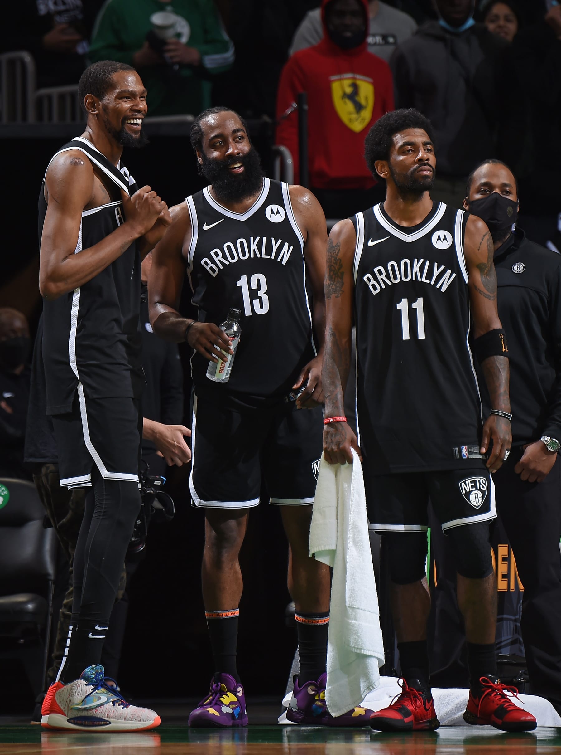 BOSTON, MA - MAY 30: Kevin Durant #7, James Harden #13 and Kyrie Irving #11 of the Brooklyn Nets smile during the game against the Boston Celtics during Round 1, Game 4 of the 2021 NBA Playoffs on May 30, 2021 at the TD Garden in Boston, Massachusetts.  NOTE TO USER: User expressly acknowledges and agrees that, by downloading and or using this photograph, User is consenting to the terms and conditions of the Getty Images License Agreement. Mandatory Copyright Notice: Copyright 2021 NBAE  (Photo by Brian Babineau/NBAE via Getty Images)