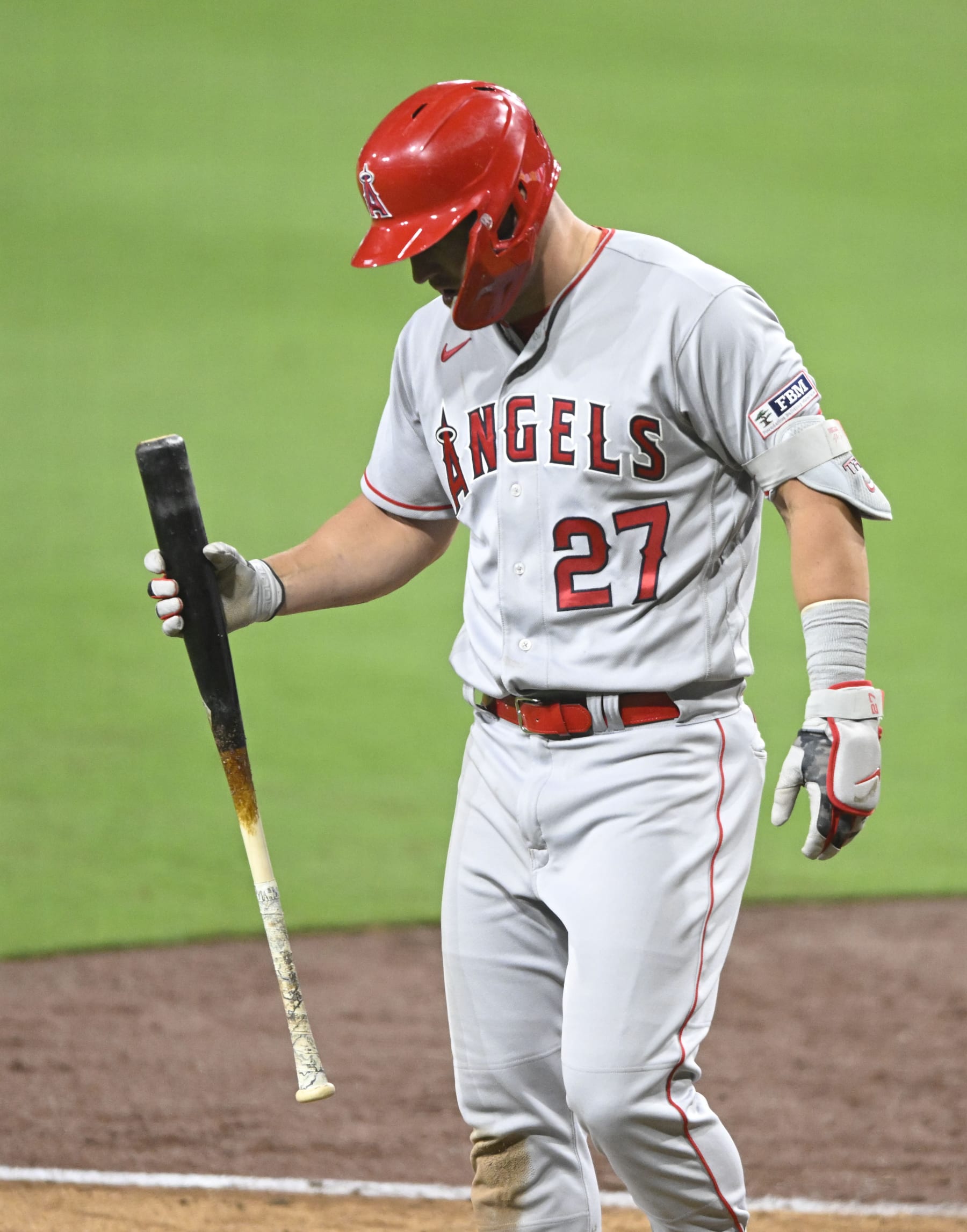 Los Angeles Angels' Mike Trout (27) leaves the game during the eighth inning of a baseball game against the San Diego Padres Monday, July 3, 2023, in San Diego. (AP Photo/Denis Poroy)