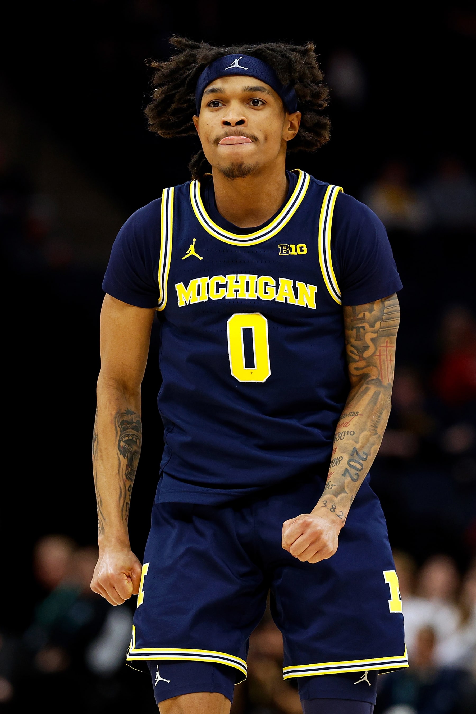 MINNEAPOLIS, MINNESOTA - MARCH 13: Dug McDaniel #0 of the Michigan Wolverines celebrates against the Penn State Nittany Lions in the second half in the First Round of the Big Ten Tournament at Target Center on March 13, 2024 in Minneapolis, Minnesota. The Nittany Lions defeated the Wolverines 66-57. (Photo by David Berding/Getty Images)