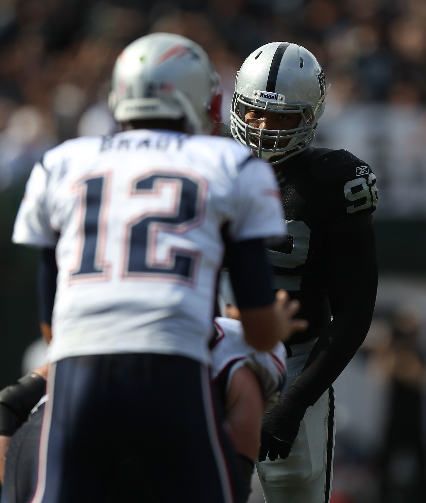 OAKLAND, CA - OCTOBER 02:  Richard Seymour #92 of the Oakland Raiders looks on against Tom Brady #12 of the New England Patriots at O.co Coliseum on October 2, 2011 in Oakland, California.  (Photo by Jed Jacobsohn/Getty Images)