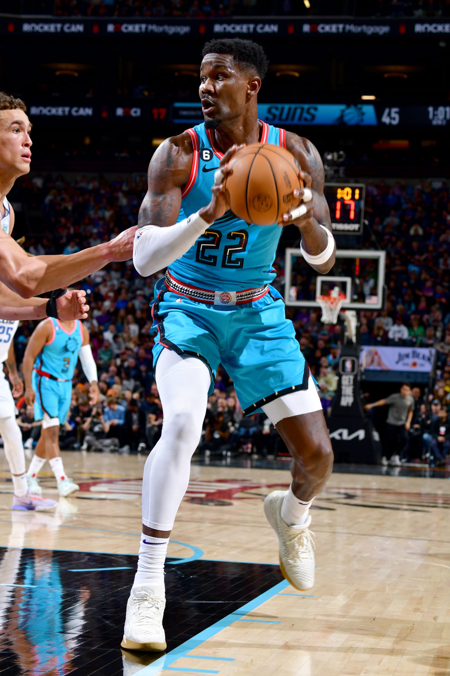 PHOENIX, AZ - JANUARY 26: Deandre Ayton #22 of the Phoenix Suns dribbles the ball during the game against the Dallas Mavericks on January 26, 2022 at Footprint Center in Phoenix, Arizona. NOTE TO USER: User expressly acknowledges and agrees that, by downloading and or using this photograph, user is consenting to the terms and conditions of the Getty Images License Agreement. Mandatory Copyright Notice: Copyright 2022 NBAE (Photo by Barry Gossage/NBAE via Getty Images)