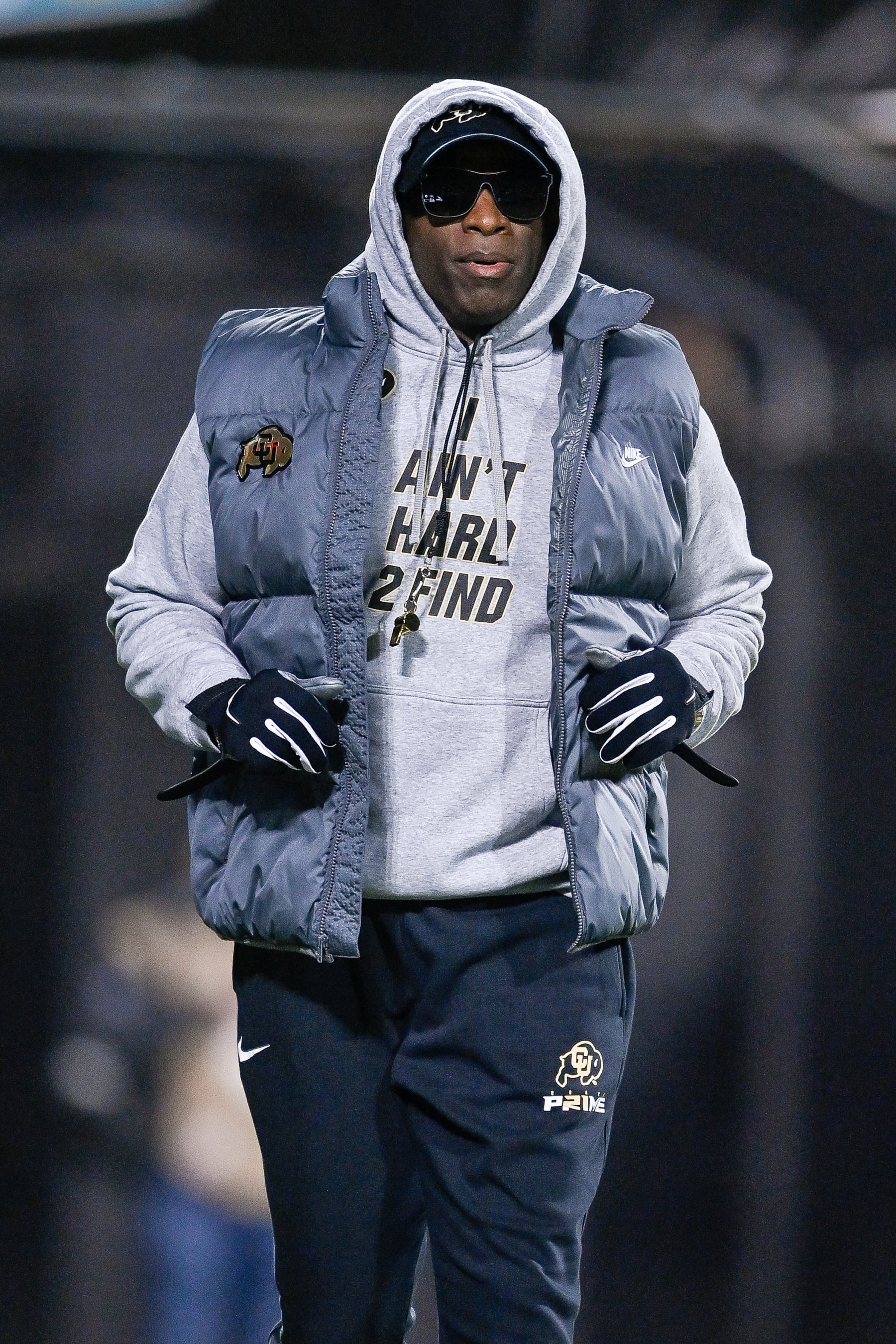 BOULDER, CO - NOVEMBER 4:  Head coach Deion Sanders of the Colorado Buffaloes jogs around the field before a game between the Colorado Buffaloes and the Oregon State Beavers at Folsom Field on November 4, 2023 in Boulder, Colorado. (Photo by Dustin Bradford/Getty Images)