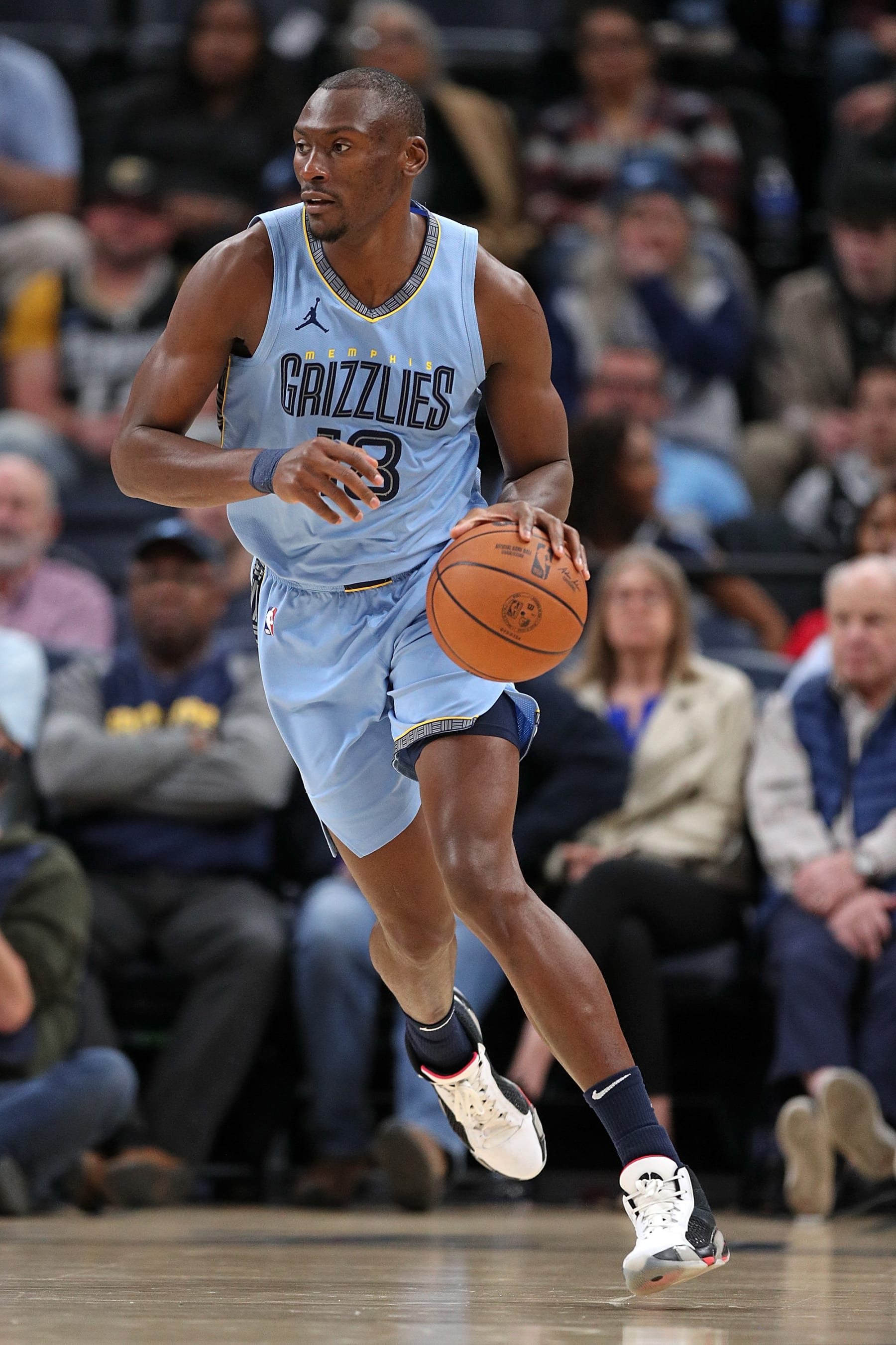 MEMPHIS, TENNESSEE - JANUARY 02: Bismack Biyombo #18 of the Memphis Grizzlies handles the ball during the game against the San Antonio Spurs at FedExForum on January 02, 2024 in Memphis, Tennessee. NOTE TO USER: User expressly acknowledges and agrees that, by downloading and or using this photograph, User is consenting to the terms and conditions of the Getty Images License Agreement. (Photo by Justin Ford/Getty Images)
