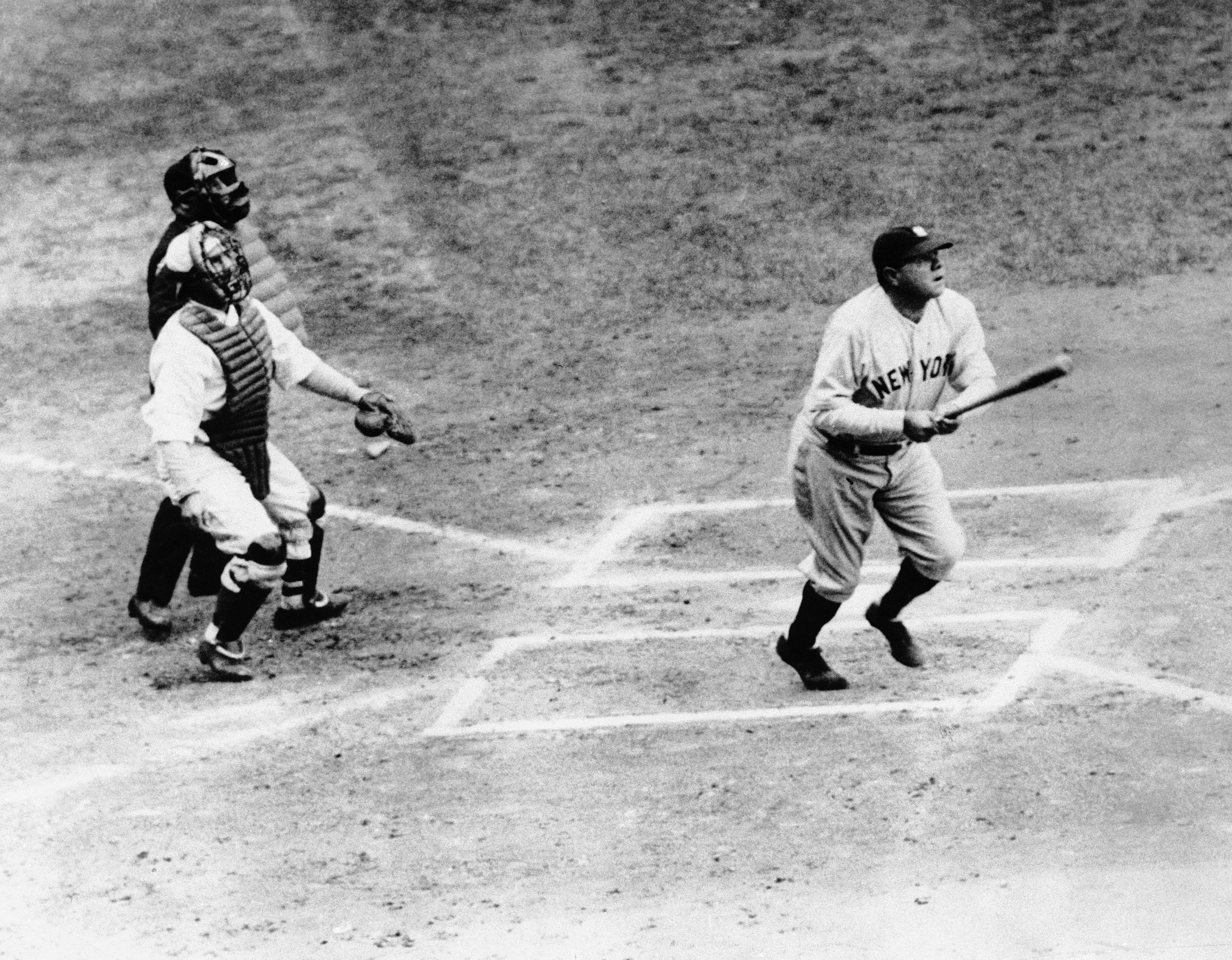 Babe Ruth the Yankee slugger, photographed as he smacked out his first home run in the Yanks, athletics game at Shibe Park in Philadelphia, April 12, 1932. Ruth Garnered two homeruns and Gehrig also poled two four hits as the yanks defeated the athletic. (AP Photo)