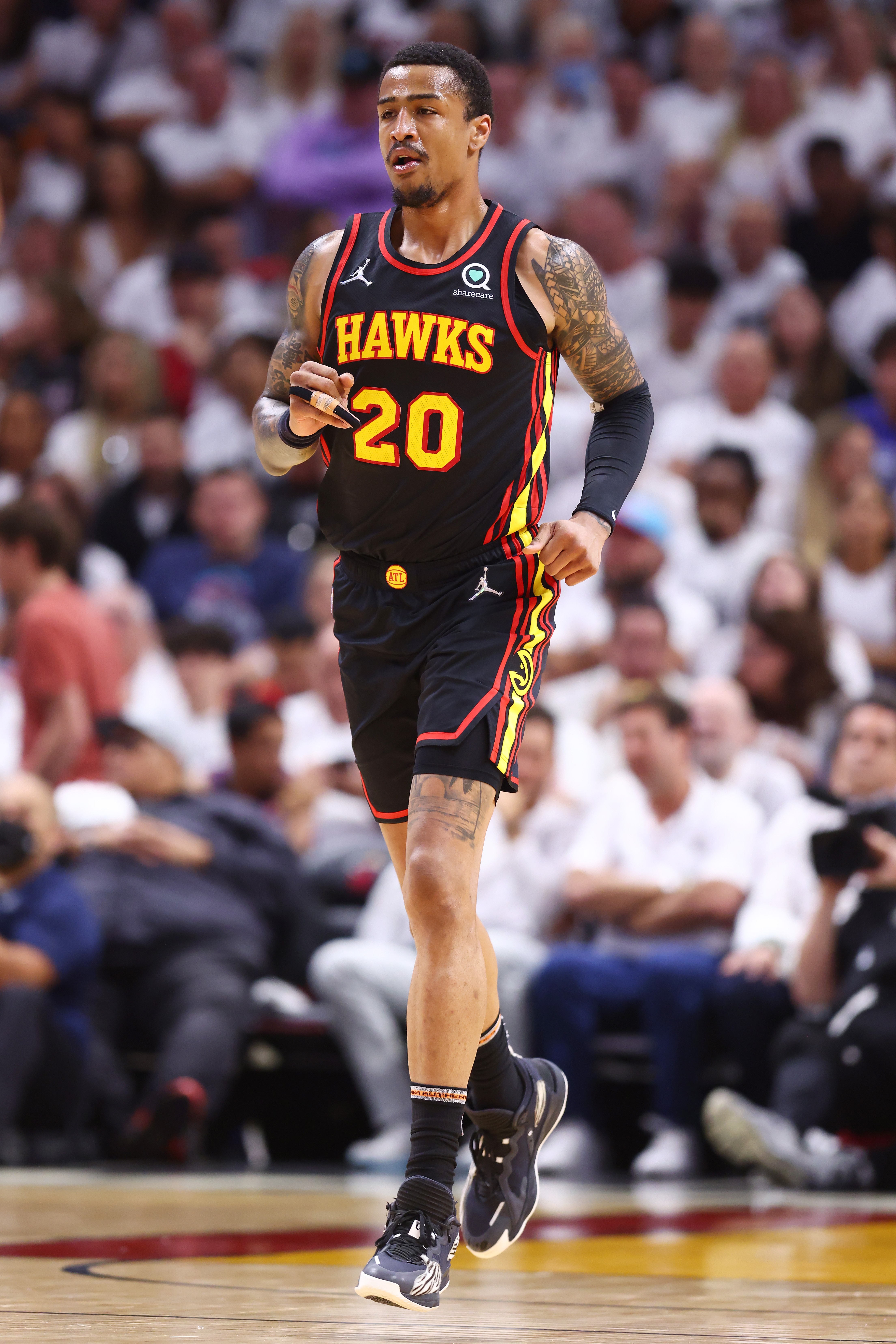 MIAMI, FLORIDA - APRIL 19: John Collins #20 of the Atlanta Hawks in action against the Miami Heat during the second quarter in Game Two of the Eastern Conference First Round at FTX Arena on April 19, 2022 in Miami, Florida. NOTE TO USER: User expressly acknowledges and agrees that, by downloading and or using this photograph, User is consenting to the terms and conditions of the Getty Images License Agreement.  (Photo by Michael Reaves/Getty Images)