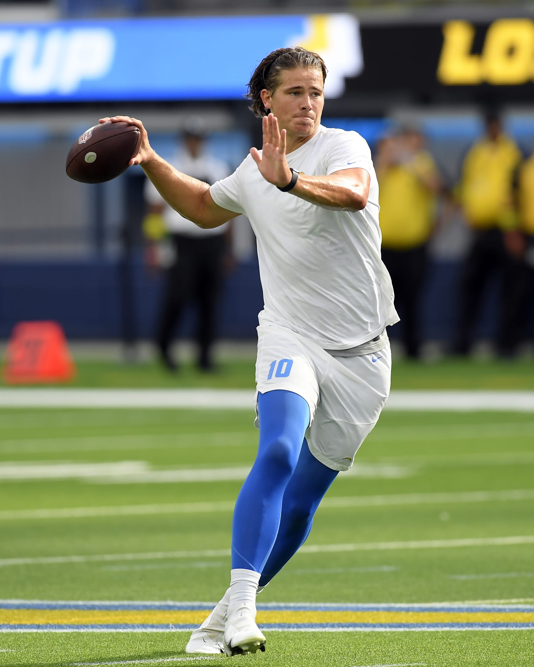 INGLEWOOD, CA - AUGUST 20: Quarterback Justin Herbert #10 of the Los Angeles Chargers warms before a preseason game against the Dallas Cowboys at SoFi Stadium on August 20, 2022 in Inglewood, California. (Photo by Kevork Djansezian/Getty Images)