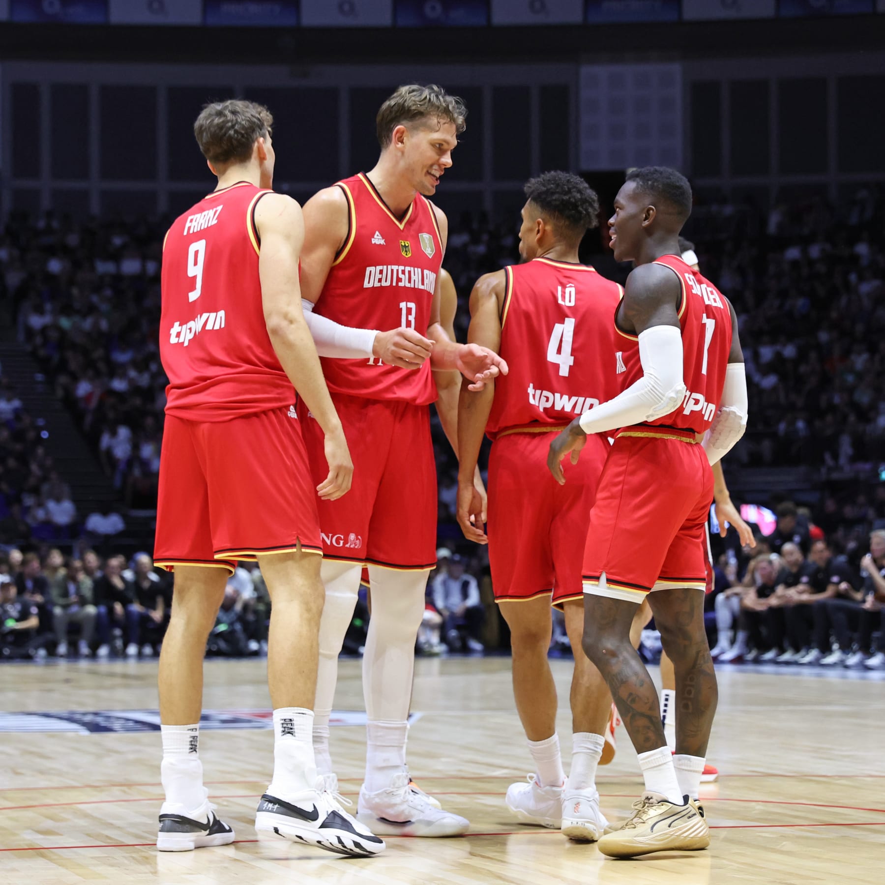 LONDON, ENGLAND - JULY 22: Moritz Wagner #13 of Team Germany talks to Dennis Schroeder #17 of Team Germany during the game against Team USA as part of the 2024 USA Basketball Showcase on July 22, 2024 in London, England at O2 Arena. NOTE TO USER: User expressly acknowledges and agrees that, by downloading and/or using this photograph, user is consenting to the terms and conditions of the Getty Images License Agreement. Mandatory Copyright Notice: Copyright 2024 NBAE (Photo by Joe Murphy/NBAE via Getty Images)