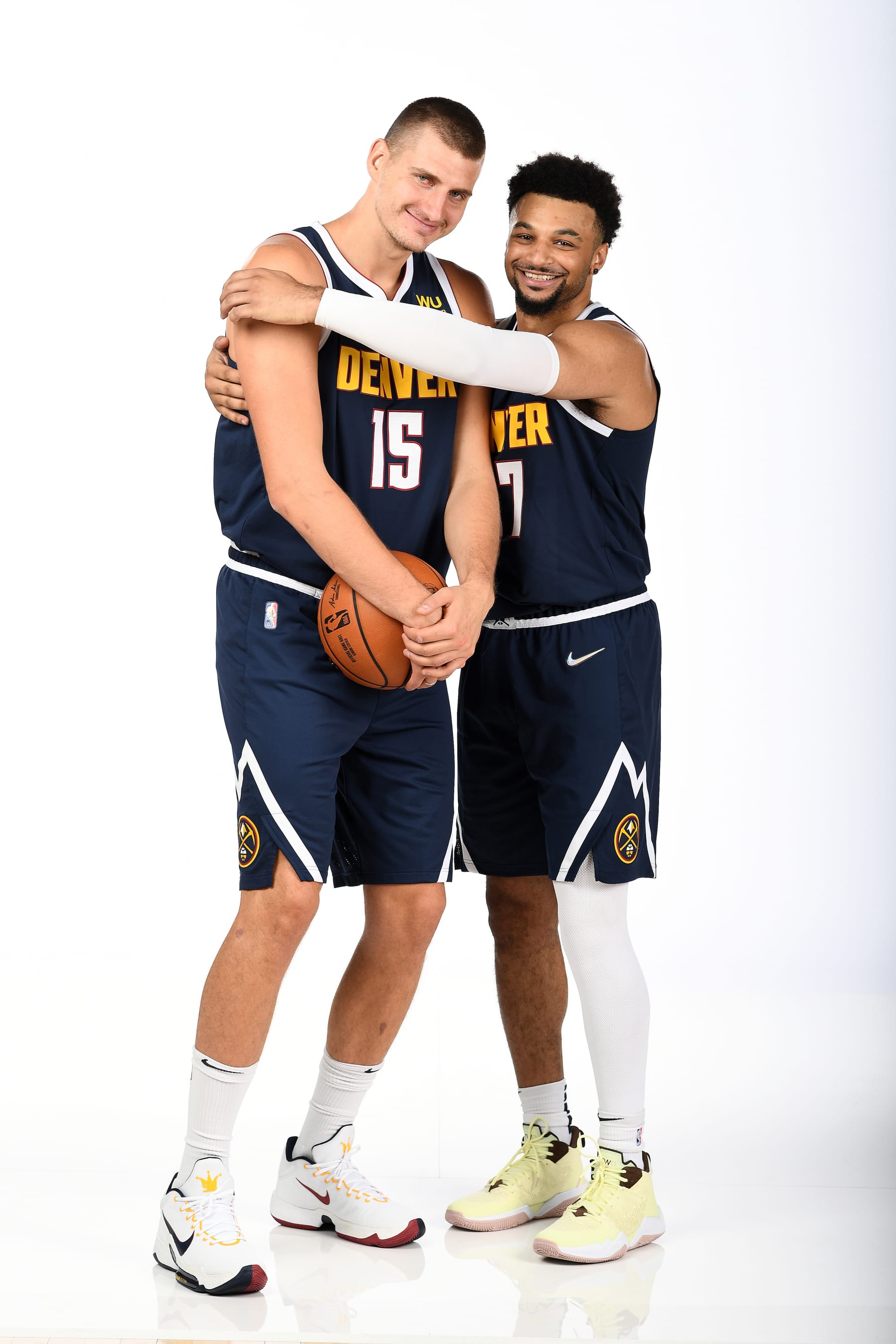 DENVER, CO - SEPTEMBER 27: Nikola Jokic #15 and Jamal Murray #27 of the Denver Nuggets pose for a portrait during NBA media day on September 27, 2021 at Ball Arena in Denver, Colorado. NOTE TO USER: User expressly acknowledges and agrees that, by downloading and/or using this Photograph, user is consenting to the terms and conditions of the Getty Images License Agreement. Mandatory Copyright Notice: Copyright 2021 NBAE (Photo by Garrett Ellwood/NBAE via Getty Images)