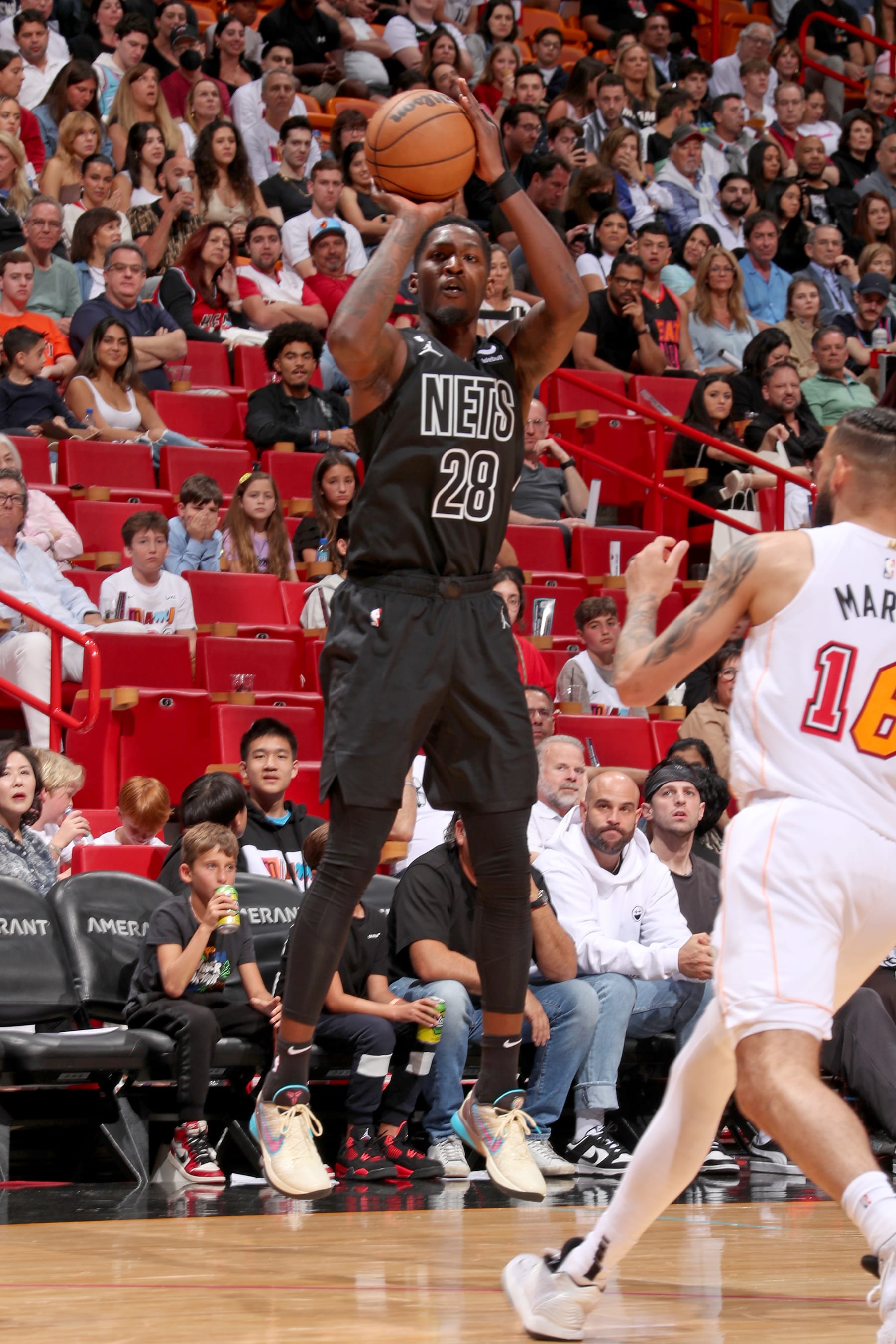 MIAMI, FL - MARCH 25:  Dorian Finney-Smith #28 of the Brooklyn Nets shoots a three point basket against the Miami Heat on March 25, 2023 at Miami-Dade Arena in Miami, Florida. NOTE TO USER: User expressly acknowledges and agrees that, by downloading and or using this Photograph, user is consenting to the terms and conditions of the Getty Images License Agreement. Mandatory Copyright Notice: Copyright 2023 NBAE (Photo by Issac Baldizon/NBAE via Getty Images)