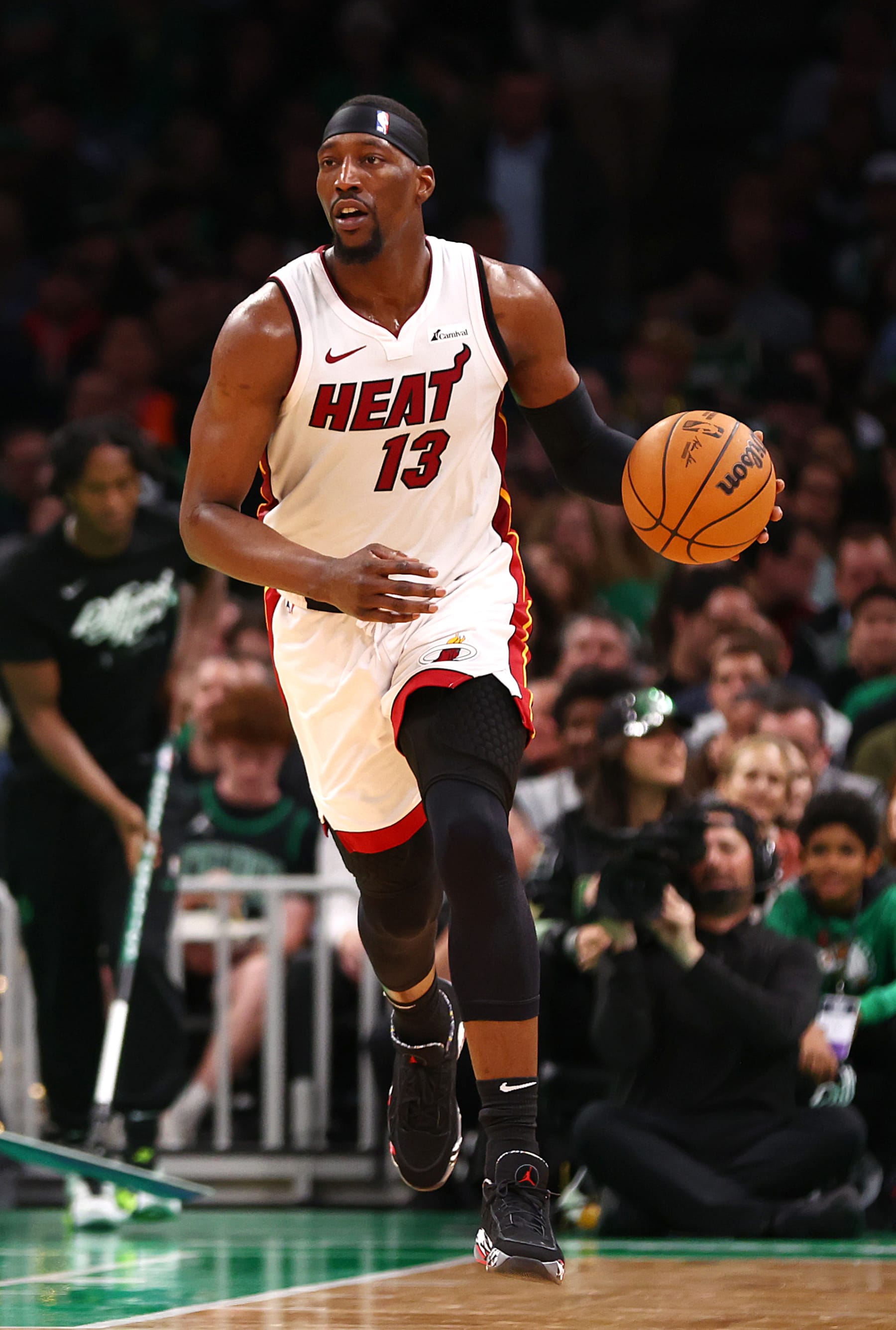 BOSTON, MASSACHUSETTS - MAY 01: Bam Adebayo #13 of the Miami Heat dribbles against the Boston Celtics during the second quarter of game five of the Eastern Conference First Round Playoffs at TD Garden on May 01, 2024 in Boston, Massachusetts. NOTE TO USER: User expressly acknowledges and agrees that, by downloading and/or using this Photograph, user is consenting to the terms and conditions of the Getty Images License Agreement.  (Photo by Maddie Meyer/Getty Images)