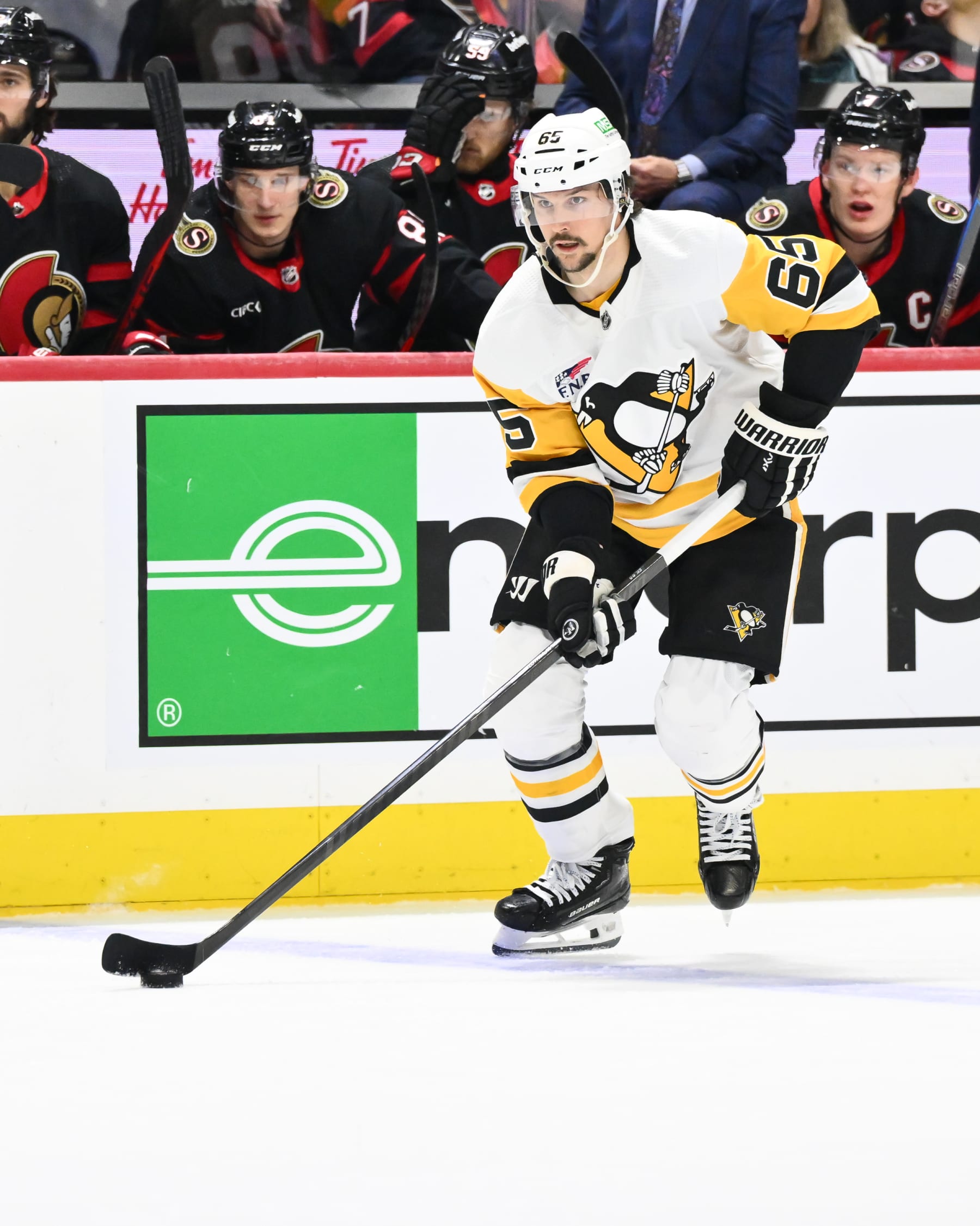 OTTAWA, CANADA - DECEMBER 23:  Erik Karlsson #65 of the Pittsburgh Penguins skates the puck during the third period against the Ottawa Senators at Canadian Tire Centre on December 23, 2023 in Ottawa, Ontario, Canada.  The Ottawa Senators defeated the Pittsburgh Penguins 5-4 in overtime.  (Photo by Minas Panagiotakis/Getty Images)