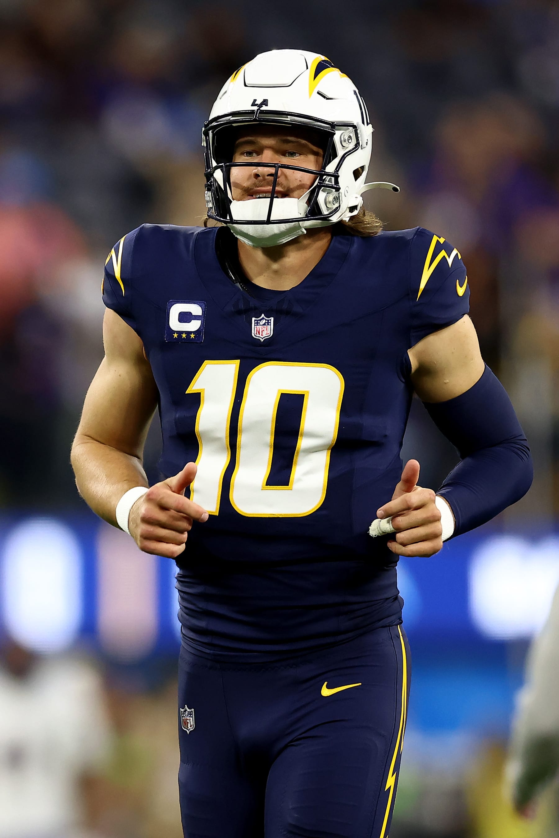 INGLEWOOD, CALIFORNIA - NOVEMBER 26: Justin Herbert #10 of the Los Angeles Chargers warms up prior to the game against the Baltimore Ravens at SoFi Stadium on November 26, 2023 in Inglewood, California. (Photo by Katelyn Mulcahy/Getty Images)