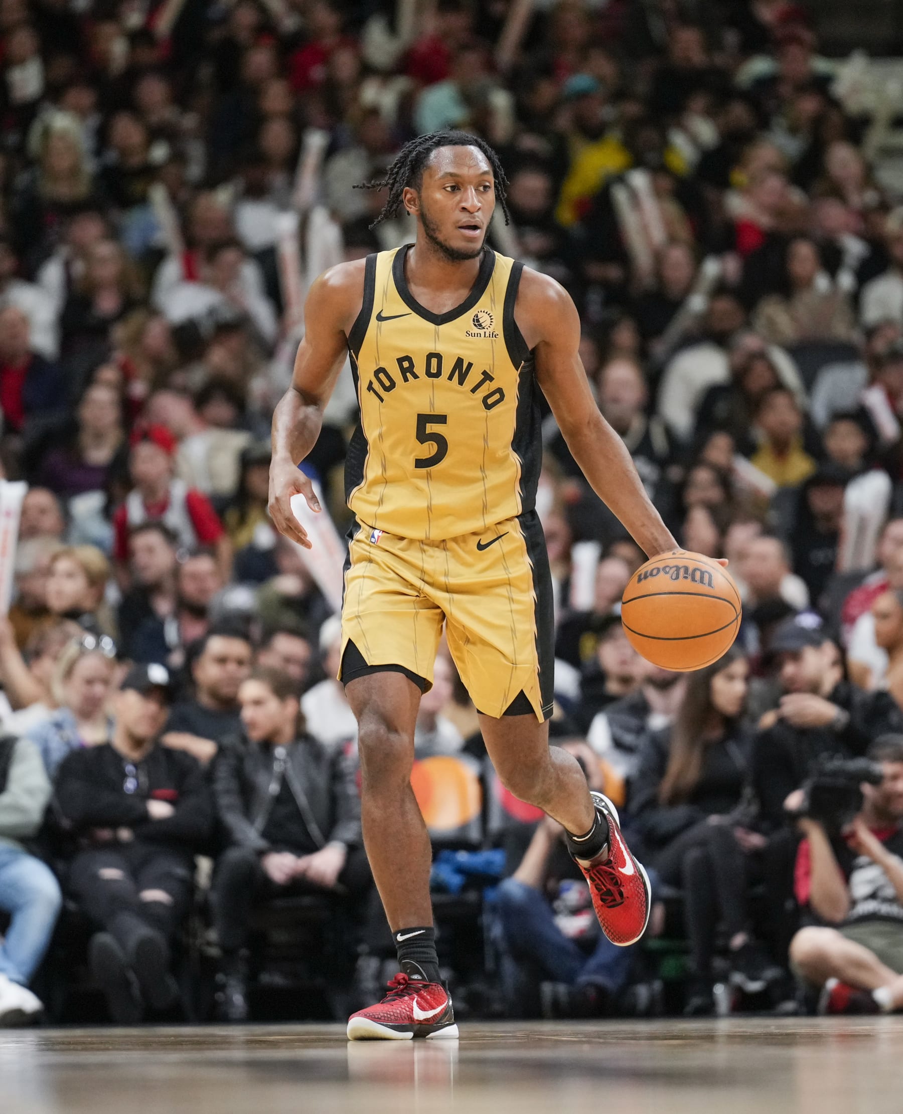 TORONTO, ON - APRIL 7: Immanuel Quickley #5 of the Toronto Raptors dribbles against the Washington Wizards during the second half of their basketball game at the Scotiabank Arena on April 7, 2024 in Toronto, Ontario, Canada. NOTE TO USER: User expressly acknowledges and agrees that, by downloading and/or using this Photograph, user is consenting to the terms and conditions of the Getty Images License Agreement. (Photo by Mark Blinch/Getty Images)