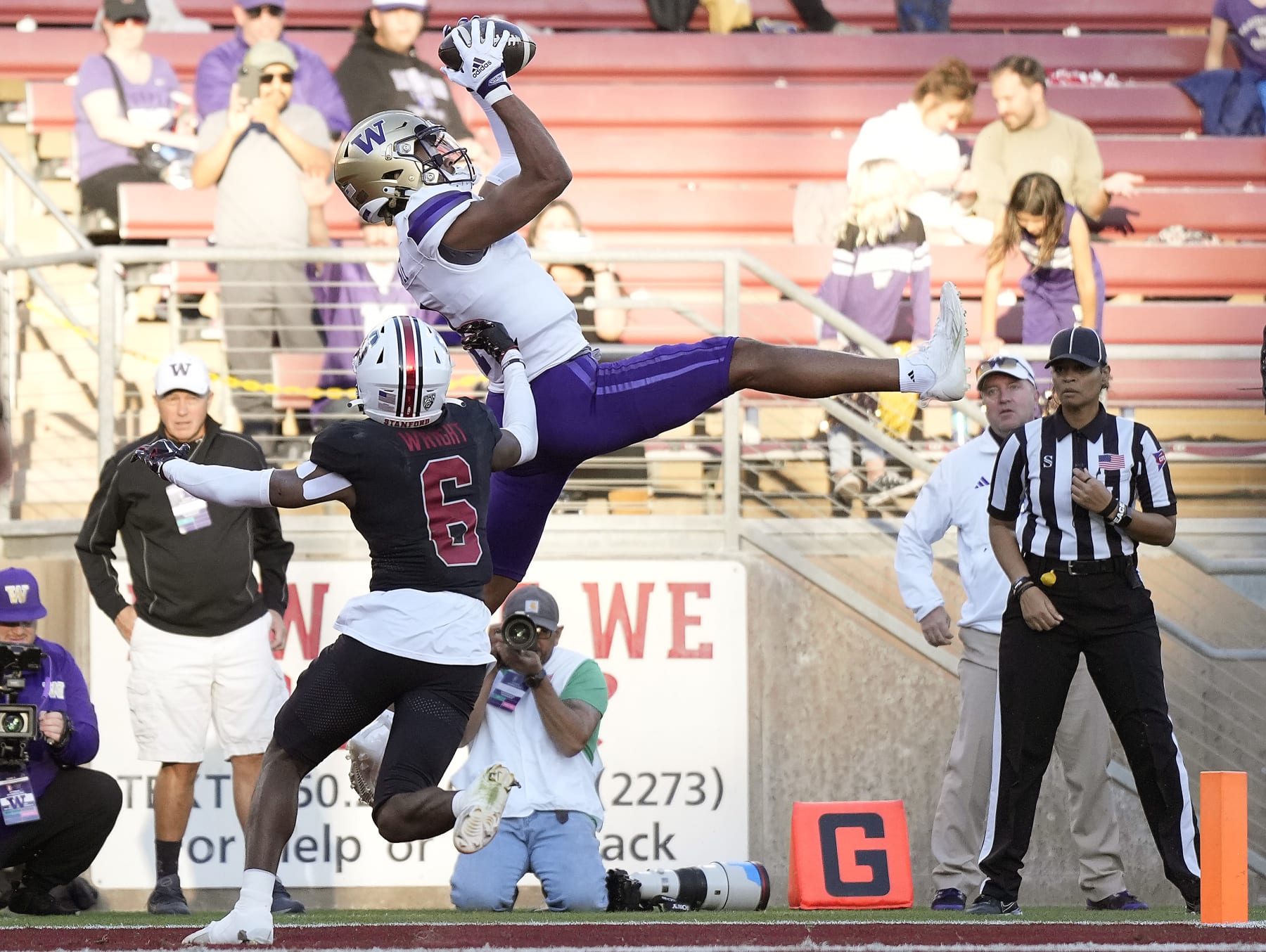 STANFORD, CALIFORNIA - OCTOBER 28: Rome Odunze #1 of the Washington Huskies catchers a touchdown pass over Collin Wright #6 of the Stanford Cardinal in the second quarter at Stanford Stadium on October 28, 2023 in Stanford, California. (Photo by Thearon W. Henderson/Getty Images)