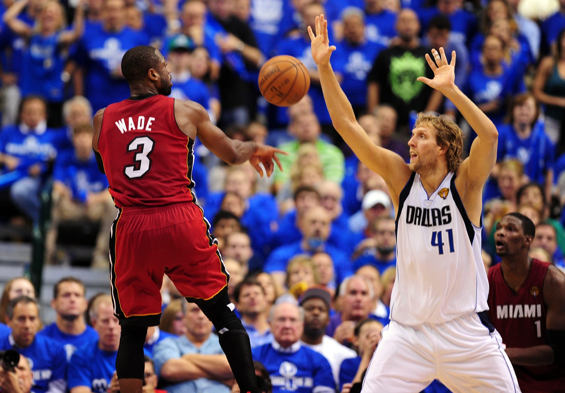 Dwyane Wade (L) of the Miami Heat throws past Dirk Nowitzki of the Dallas Mavericksduring game 4 of the NBA Finals on June 7, 2011 at the American Airlines Center in Dallas, Texas.  The Dallas Mavericks defeated the Miami Heat 86-83.   AFP PHOTO / Robyn BECK AFP PHOTO / ROBYN BECK (Photo credit should read ROBYN BECK/AFP via Getty Images)