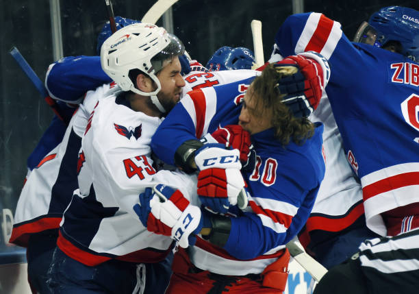 NEW YORK, NEW YORK - MAY 03: Tom Wilson #43 of the Washington Capitals takes a roughing penalty during the second period against Artemi Panarin #10 of the New York Rangers at Madison Square Garden on May 03, 2021 in New York City. (Photo by Bruce Bennett/Getty Images)