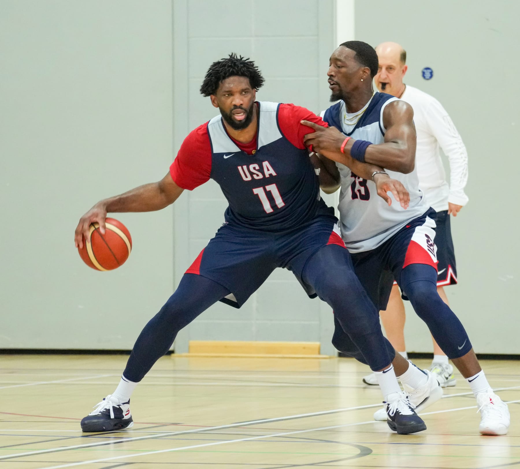 LONDON, ENGLAND - JULY 19: Joel Embiid #11 of Team USA handles the ball while Bam Adebayo #13 of Team USA plays defense during practice as part of 2024 USA Basketball Showcase on July 19, 2024 in London, England as part of the 2024 USA Basketball Showcase. NOTE TO USER: User expressly acknowledges and agrees that, by downloading and/or using this photograph, user is consenting to the terms and conditions of the Getty Images License Agreement. Mandatory Copyright Notice: Copyright 2024 NBAE (Photo by Ryan Stetz/NBAE via Getty Images)